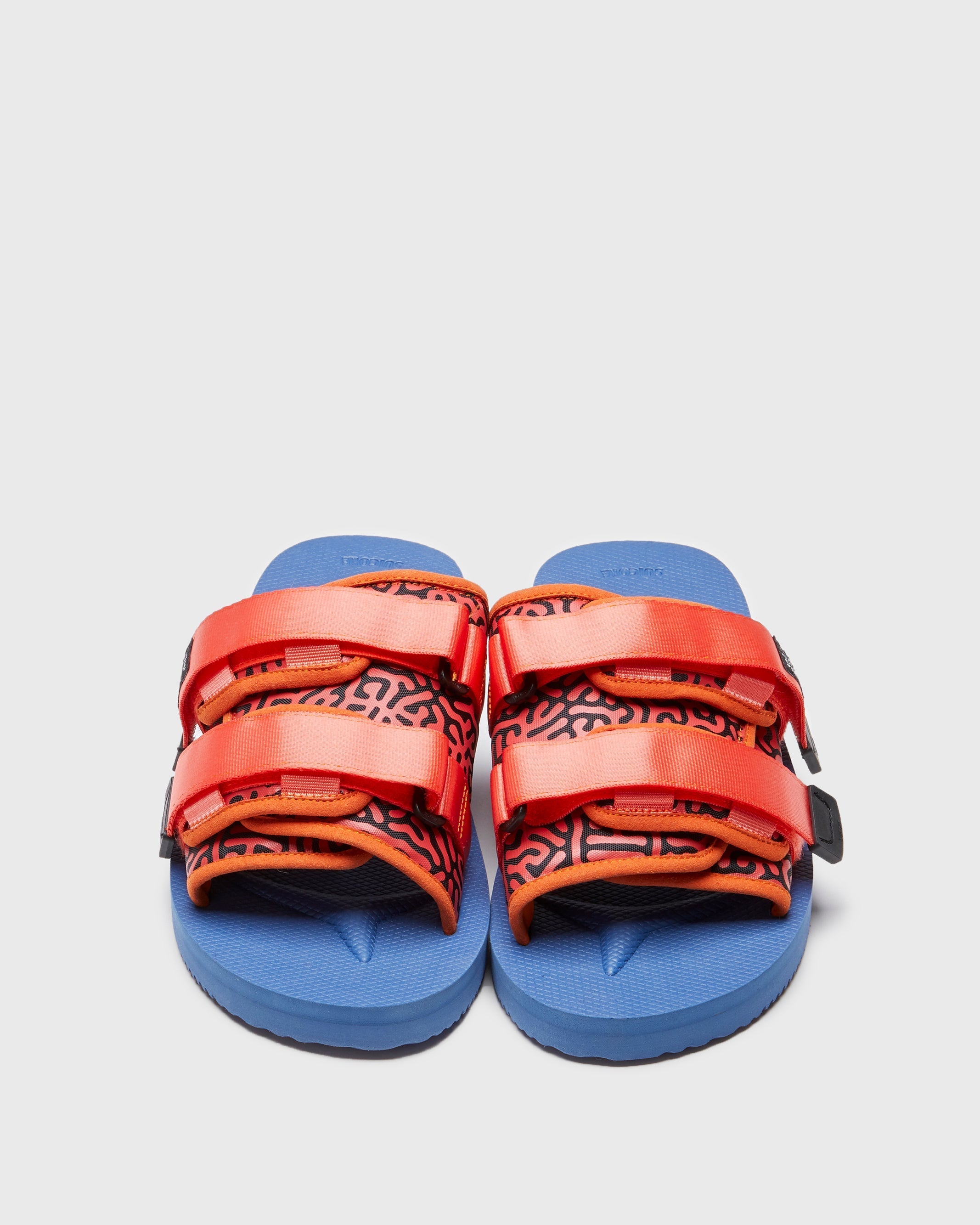 SUICOKE MOTO-Cab-PT06 slides with orange & navy nylon upper, orange & navy midsole and sole, strap and logo patch. From Spring/Summer 2023 collection on SUICOKE Official US & Canada Webstore. OG-056CAB-PT06 ORANGE X NAVY