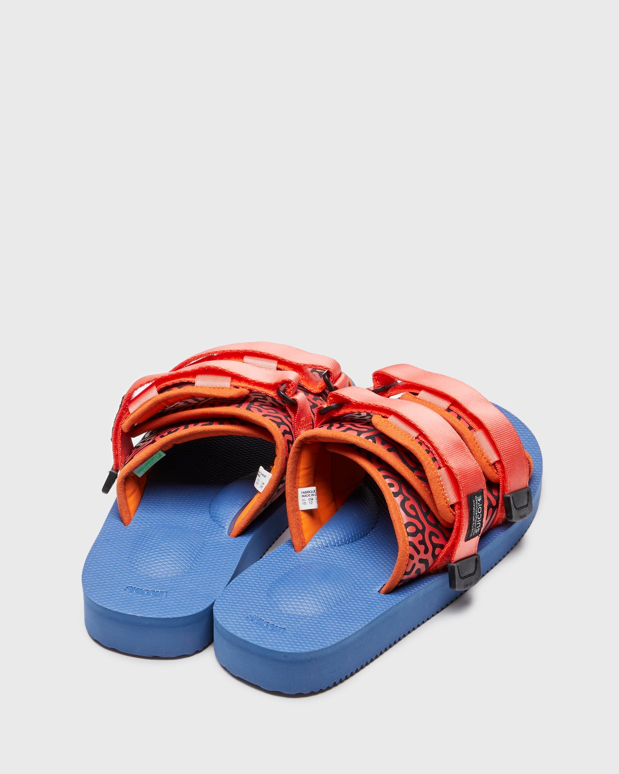 SUICOKE MOTO-Cab-PT06 slides with orange & navy nylon upper, orange & navy midsole and sole, strap and logo patch. From Spring/Summer 2023 collection on SUICOKE Official US & Canada Webstore. OG-056CAB-PT06 ORANGE X NAVY