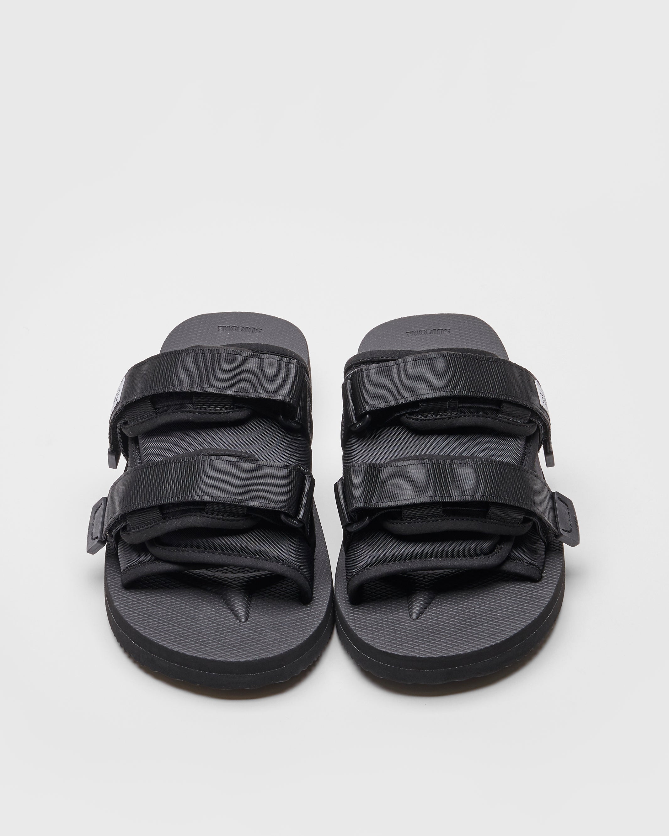 SUICOKE MOTO-Cab slides with black nylon upper, black midsole and sole, straps and logo patch. From Spring/Summer 2022 collection on SUICOKE Official US &amp; Canada Webstore.