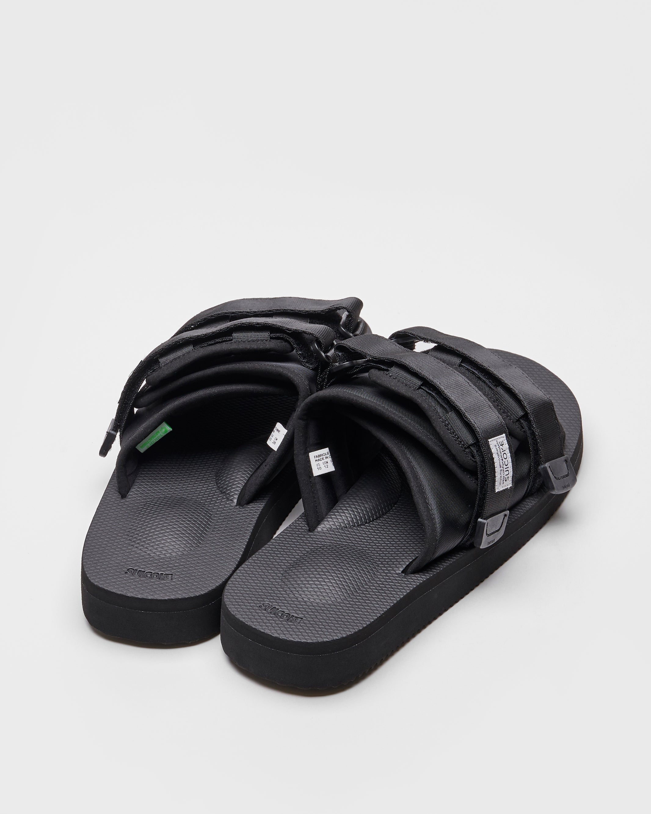 SUICOKE MOTO-Cab slides with black nylon upper, black midsole and sole, straps and logo patch. From Spring/Summer 2022 collection on SUICOKE Official US &amp; Canada Webstore.