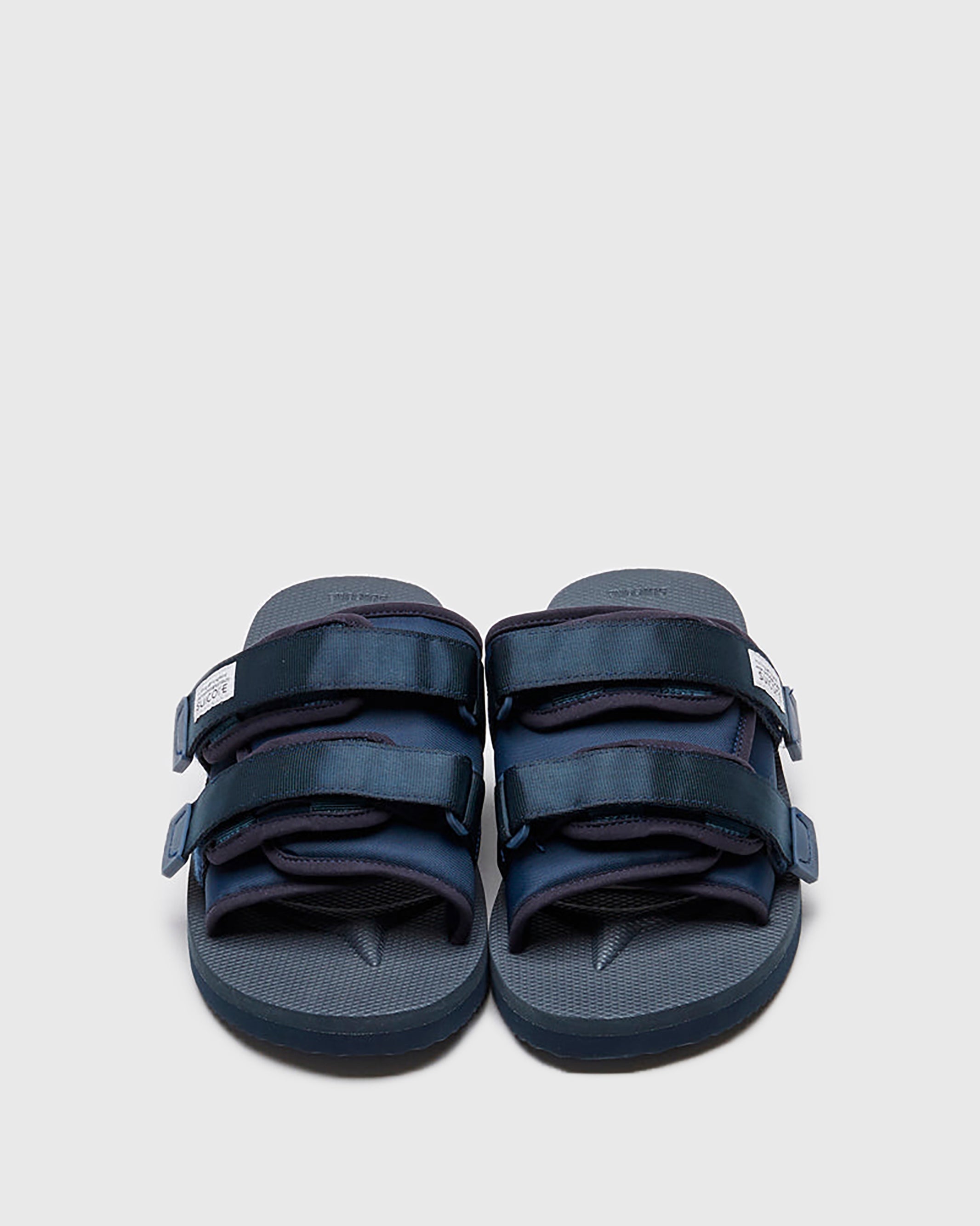 SUICOKE MOTO-Cab slides with navy nylon upper, navy midsole and sole, straps and logo patch. From Spring/Summer 2023 collection on SUICOKE Official US & Canada Webstore. OG-056CAB NAVY