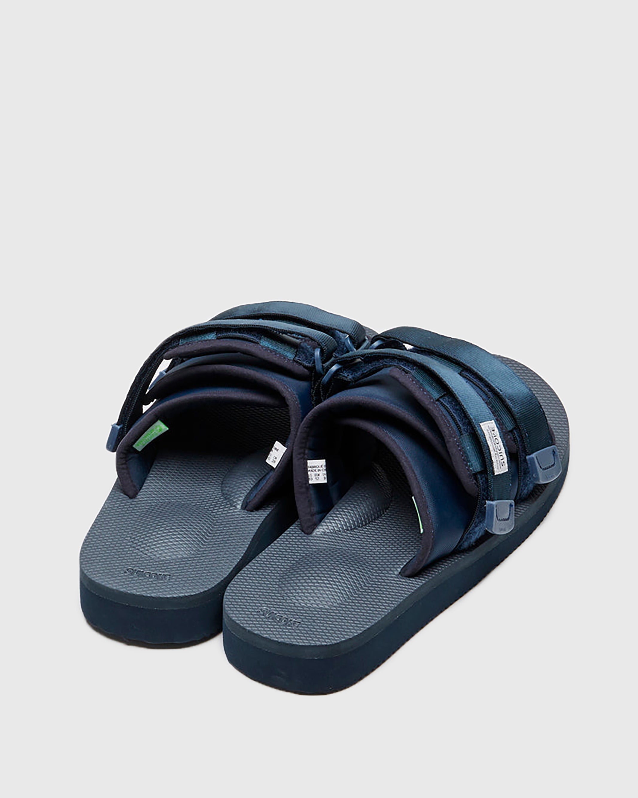 SUICOKE MOTO-Cab slides with navy nylon upper, navy midsole and sole, straps and logo patch. From Spring/Summer 2023 collection on SUICOKE Official US & Canada Webstore. OG-056CAB NAVY