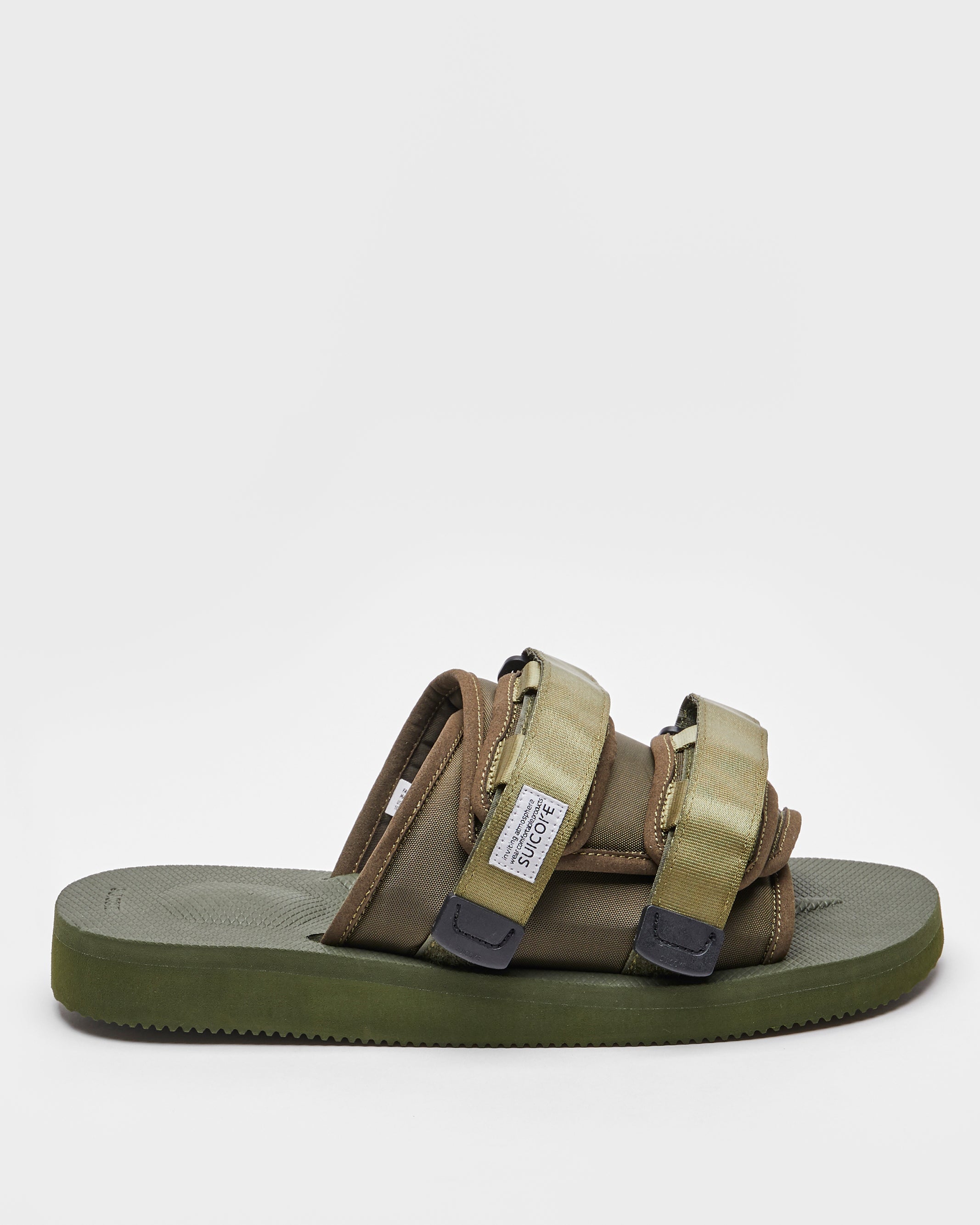 SUICOKE MOTO-Cab slides with olive nylon upper, olive midsole and sole, straps and logo patch. From Spring/Summer 2023 collection on SUICOKE Official US & Canada Webstore. OG-056CAB OLIVE