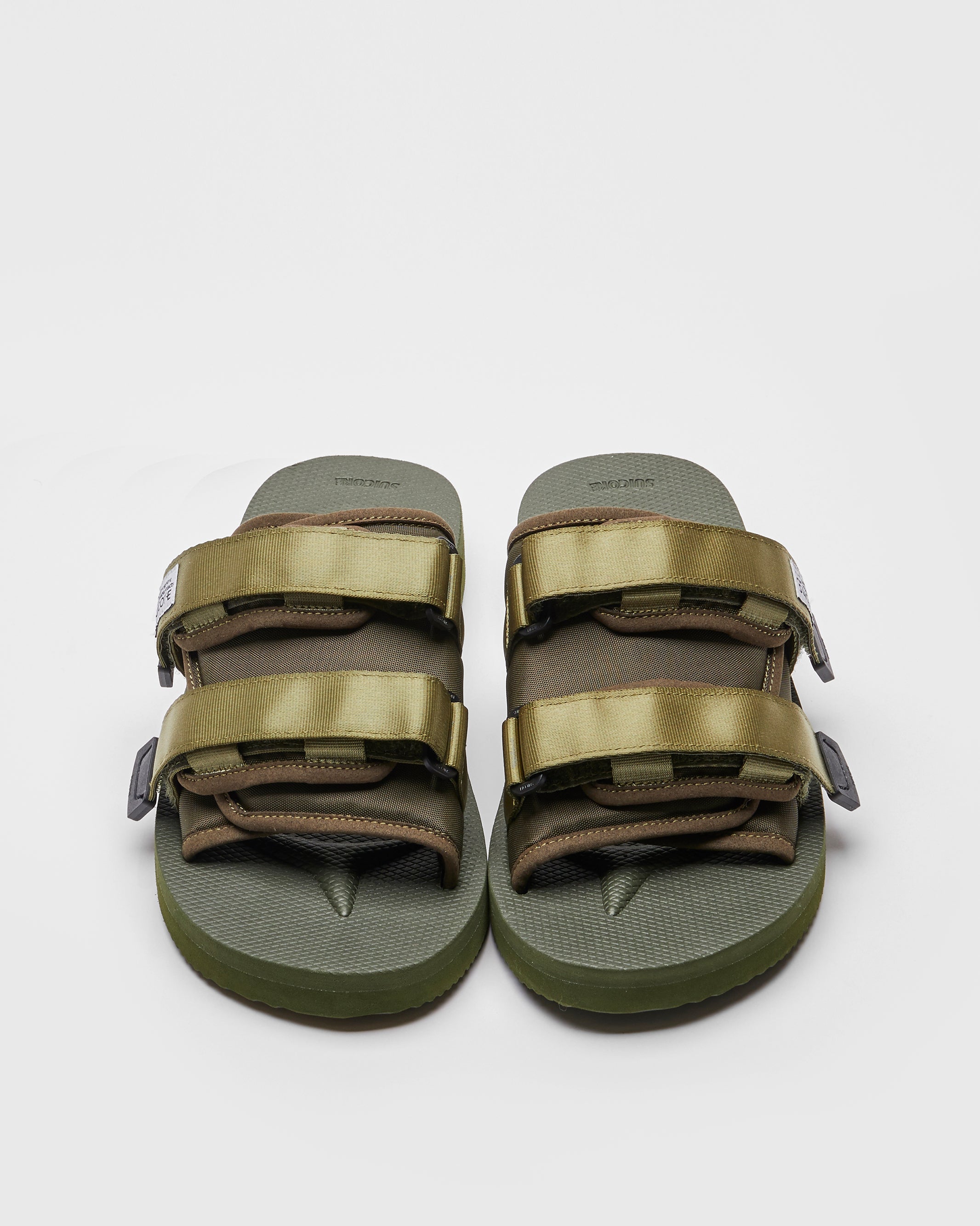 SUICOKE MOTO-Cab slides with olive nylon upper, olive midsole and sole, straps and logo patch. From Spring/Summer 2023 collection on SUICOKE Official US & Canada Webstore. OG-056CAB OLIVE