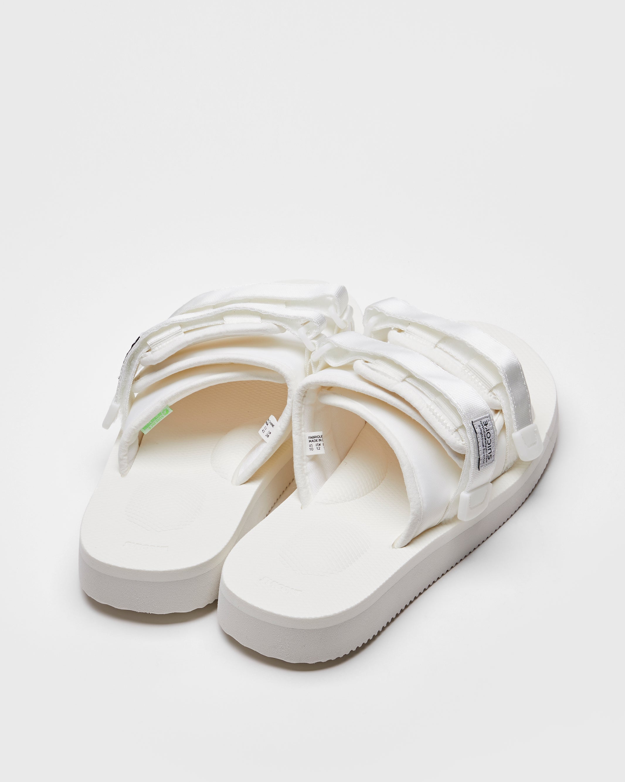 SUICOKE MOTO-Cab slides with white nylon upper, white midsole and sole, straps and logo patch. From Spring/Summer 2022 collection on SUICOKE Official US & Canada Webstore.