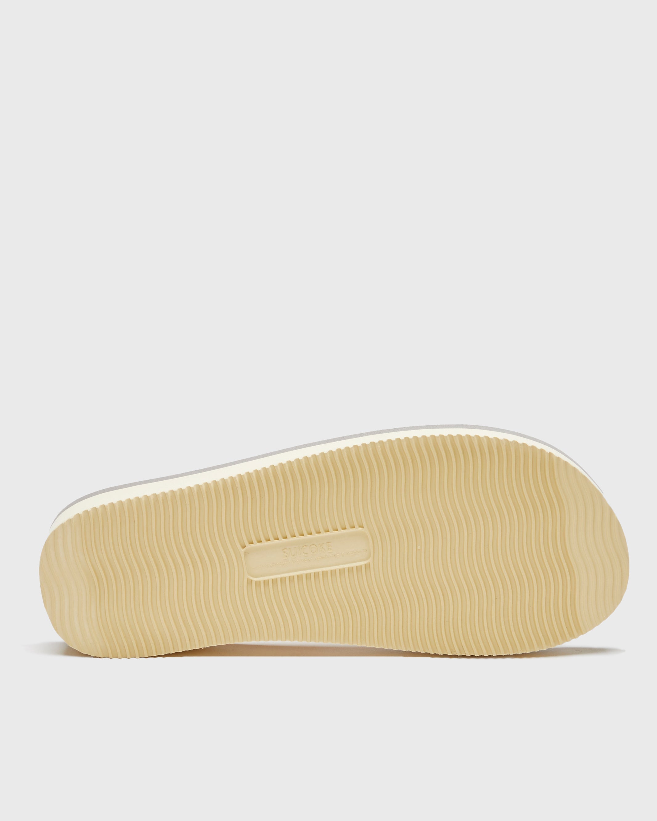 SUICOKE MOTO-Cab slides with yellow & beige nylon upper, yellow & beige midsole and sole, straps and logo patch. From Spring/Summer 2023 collection on SUICOKE Official US & Canada Webstore. OG-056CAB YELLOW X BEIGE