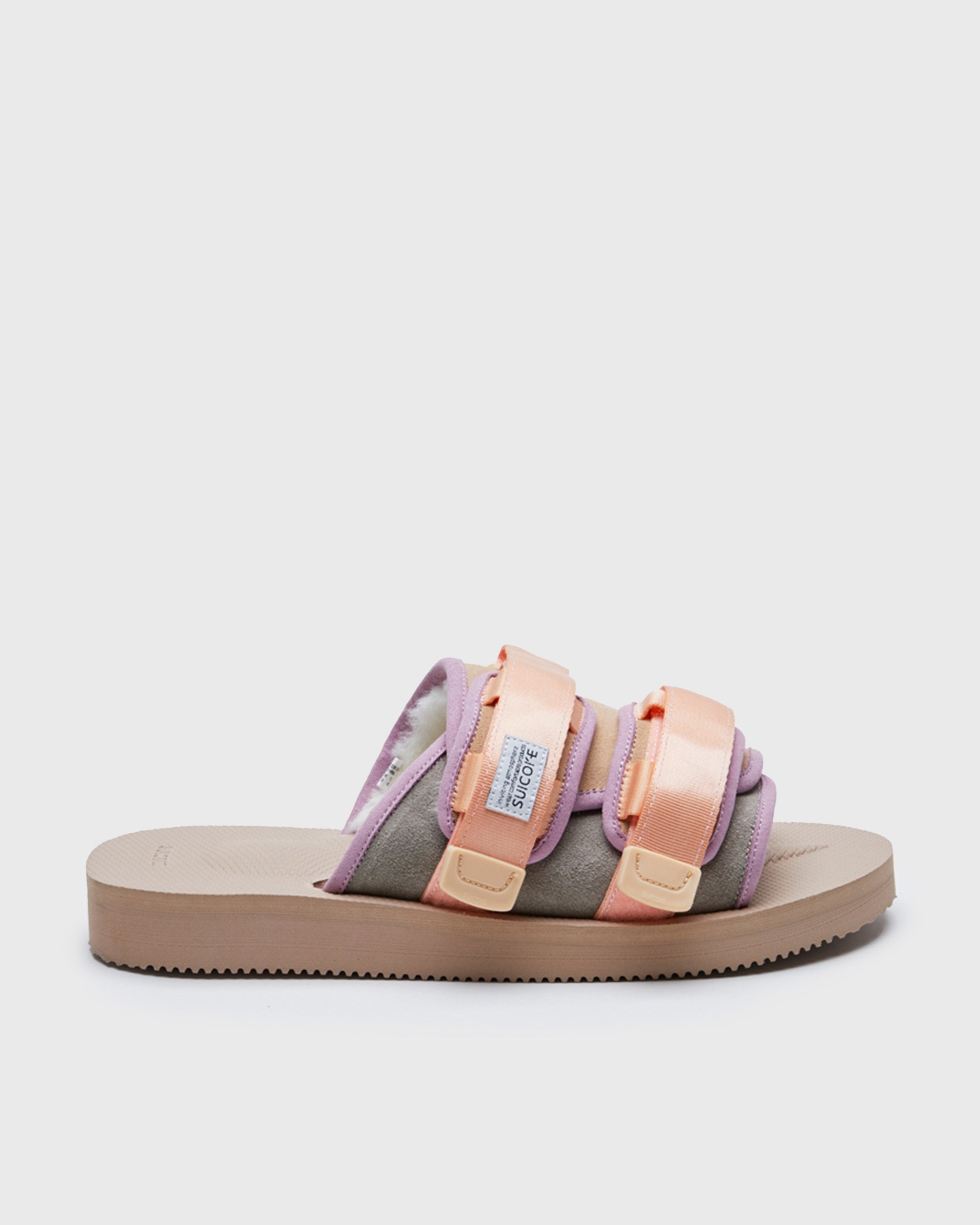 SUICOKE MOTO-Mab suede slides with beige midsole and sole, gray suede upper and shearling inside with light purple piping and light pink nylon straps. From Fall/Winter 2021 collection on SUICOKE Official US & Canada Webstore.