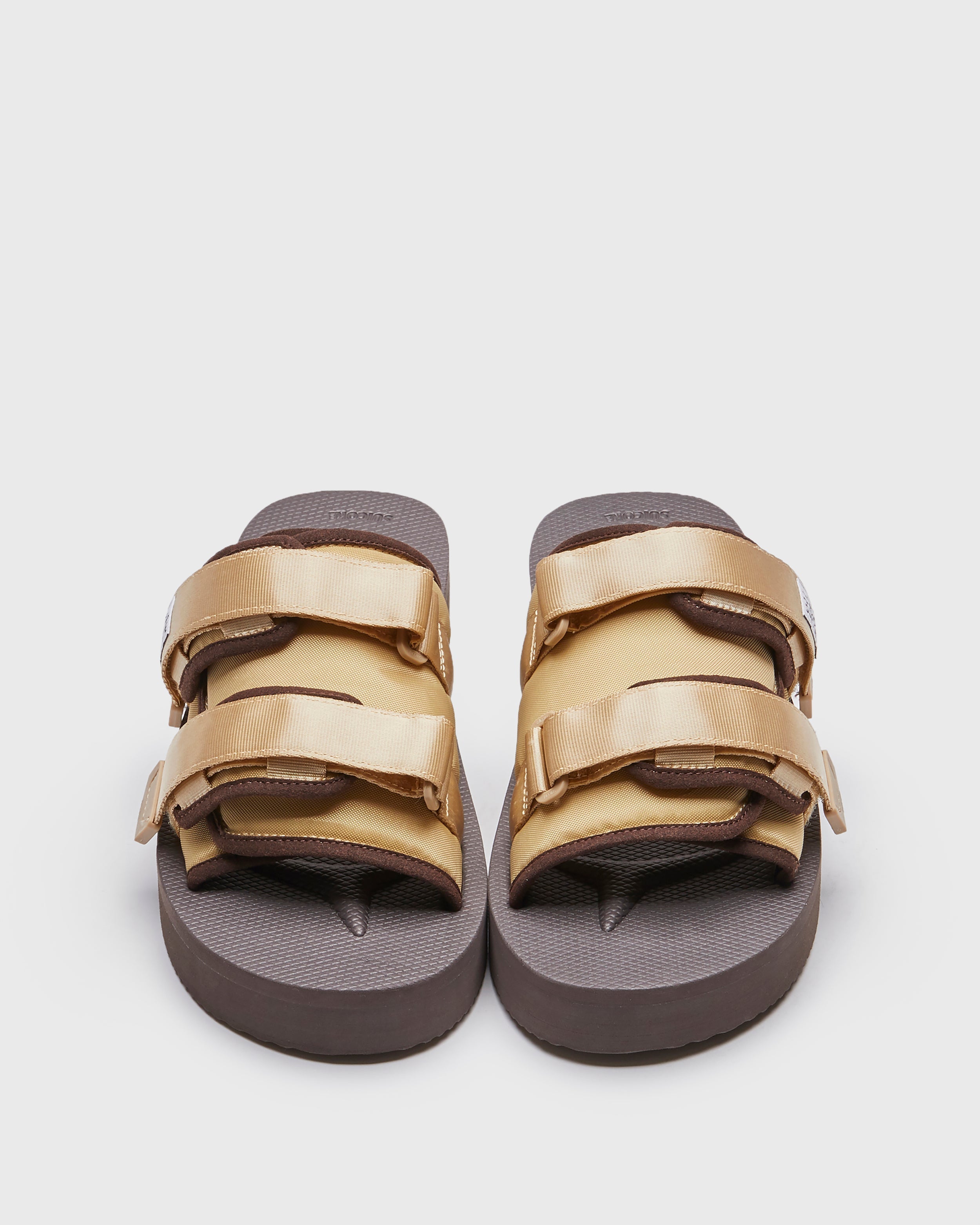 SUICOKE MOTO-PO slides with brown & sand nylon upper, brown & sand midsole and sole, strap and logo patch. From Spring/Summer 2023 collection on SUICOKE Official US & Canada Webstore. OG-056PO BROWN X SAND