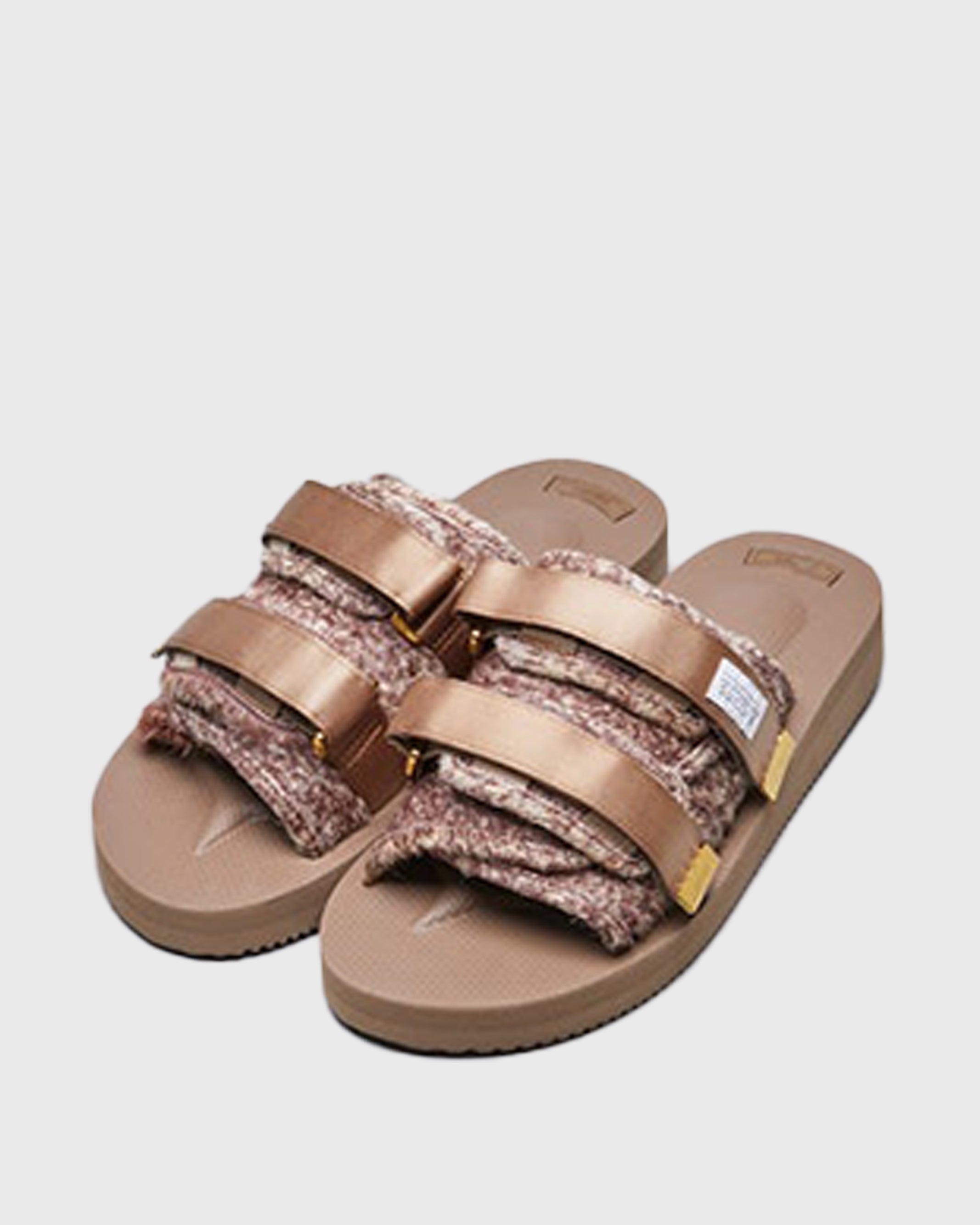 SUICOKE MOTO-Vhl slides with brown calf hair upper, beige midsole and sole, straps and logo patch. From Fall/Winter 2020 collection on SUICOKE Official US & Canada Webstore.