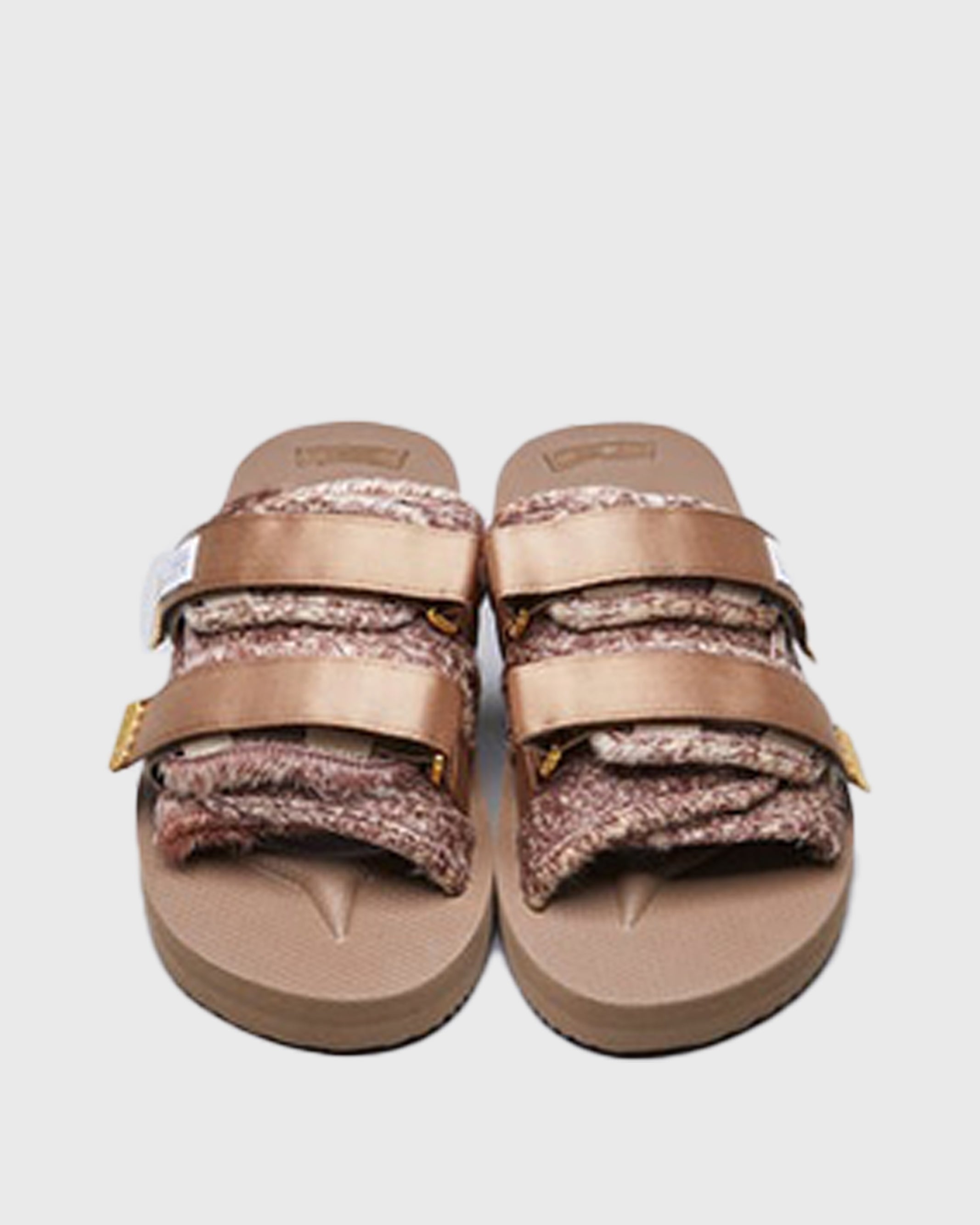 SUICOKE MOTO-Vhl slides with brown calf hair upper, beige midsole and sole, straps and logo patch. From Fall/Winter 2020 collection on SUICOKE Official US & Canada Webstore.