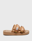 SUICOKE MOTO-Vhl slides with camel colored calf hair upper, camel colored midsole and sole, straps with logo patch and gold logoed tabs. From Fall/Winter 2021 collection on SUICOKE Official US & Canada Webstore.