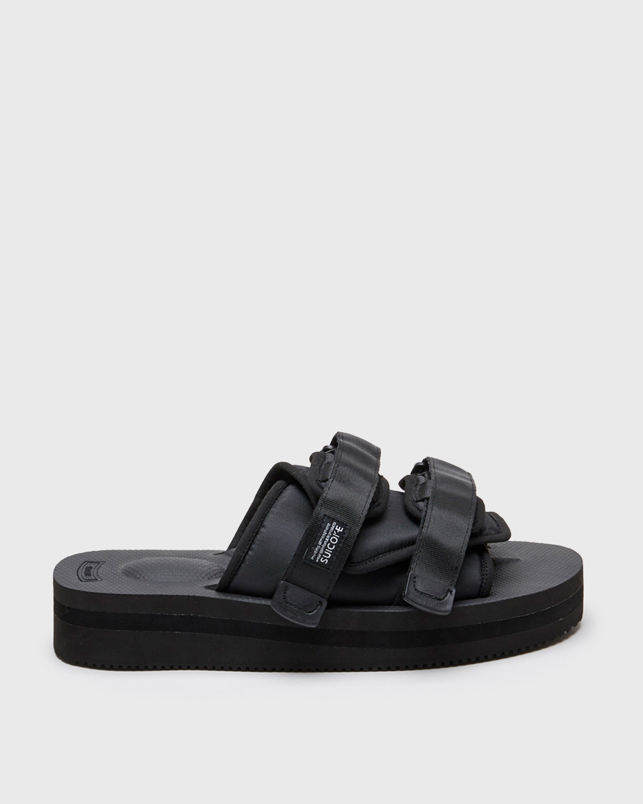 SUICOKE MOTO-VPO slides with black nylon upper, black midsole and sole, straps and logo patch. From Spring/Summer 2022 collection on SUICOKE Official US & Canada Webstore.