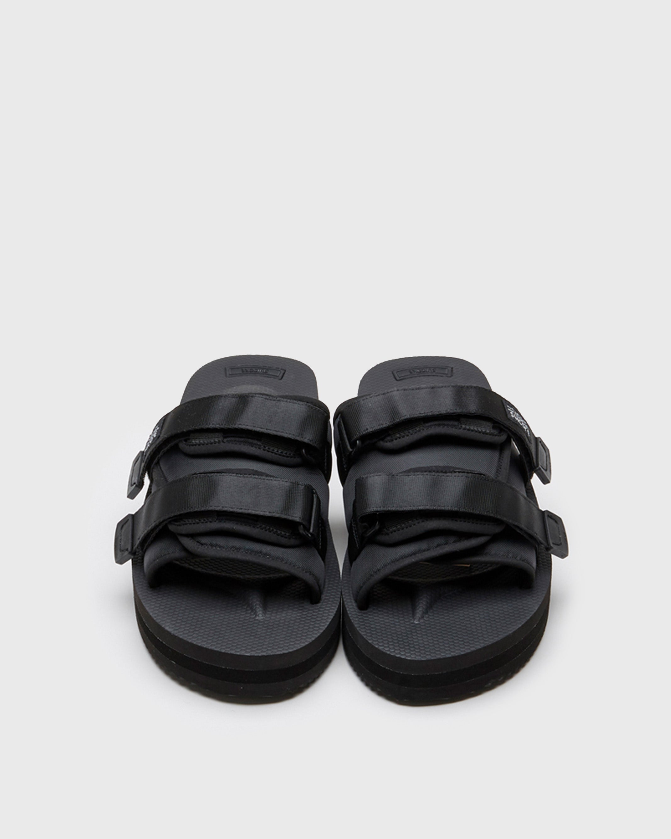 SUICOKE MOTO-VPO slides with black nylon upper, black midsole and sole, straps and logo patch. From Spring/Summer 2022 collection on SUICOKE Official US & Canada Webstore.