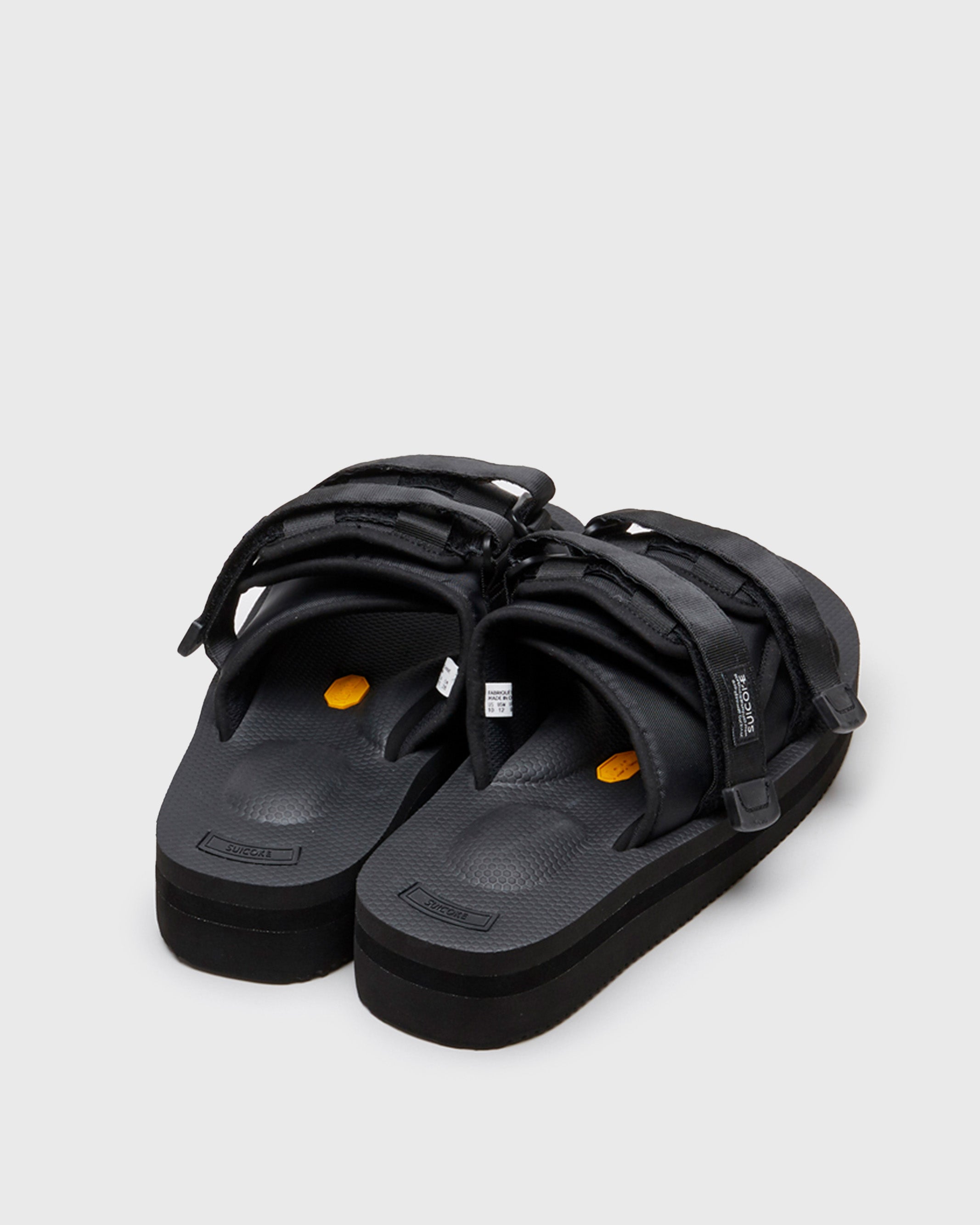 SUICOKE MOTO-VPO slides with black nylon upper, black midsole and sole, straps and logo patch. From Spring/Summer 2022 collection on SUICOKE Official US & Canada Webstore.