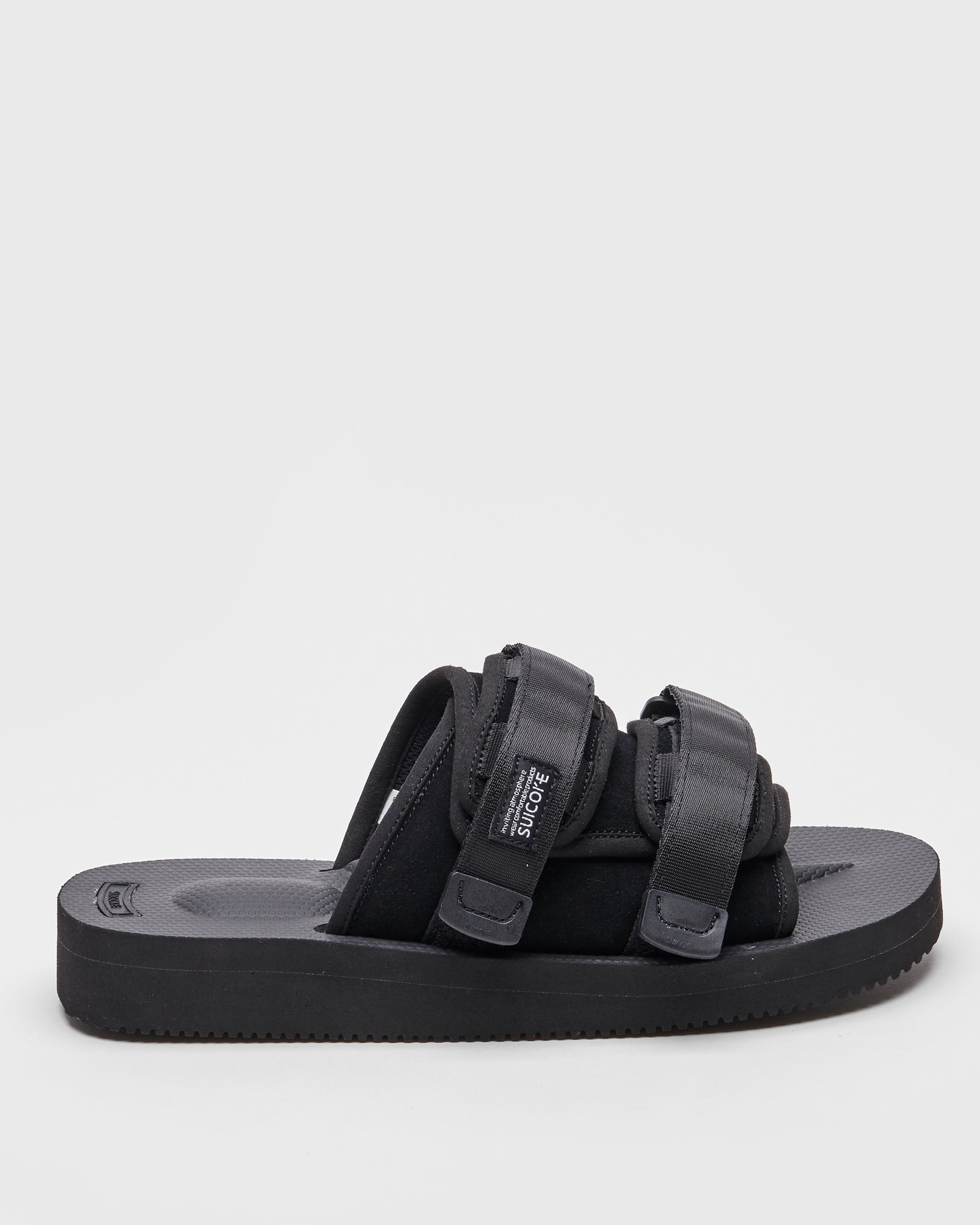 SUICOKE MOTO-VS slides with black cow suede upper, black midsole and sole, straps and logo patch. From Spring/Summer 2022 collection on SUICOKE Official US & Canada Webstore.