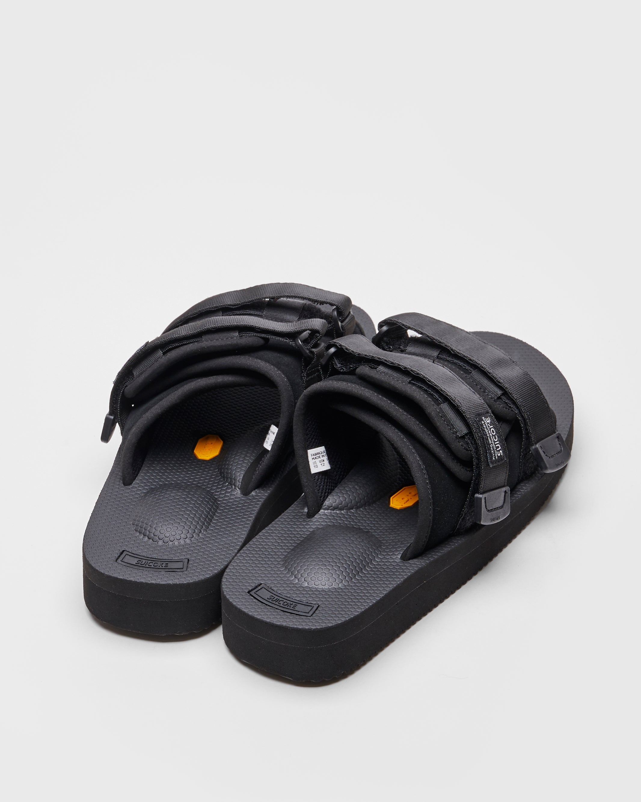 SUICOKE MOTO-VS slides with black cow suede upper, black midsole and sole, straps and logo patch. From Spring/Summer 2022 collection on SUICOKE Official US & Canada Webstore.