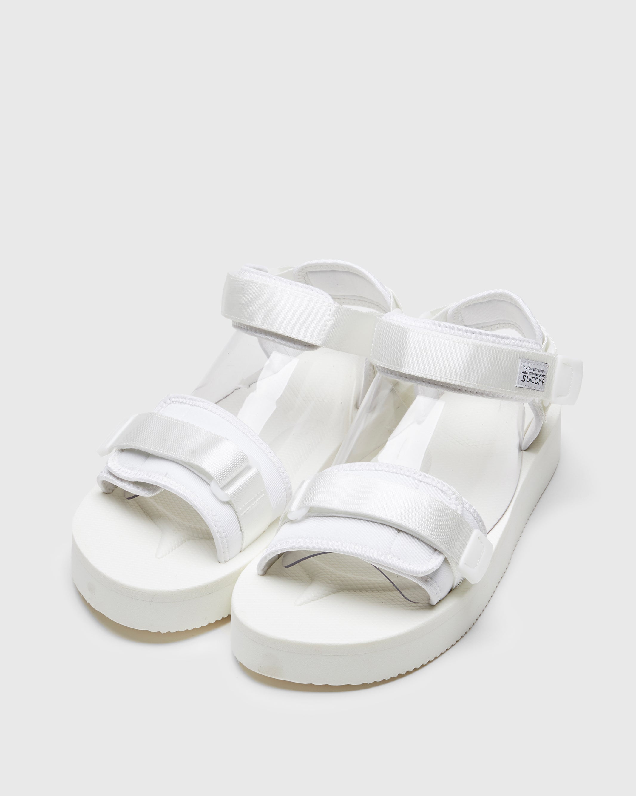 SUICOKE CEL-PO sandals with white nylon upper, white midsole and sole, strap and logo patch. From Spring/Summer 2023 collection on SUICOKE Official US & Canada Webstore. OG-064PO WHITE