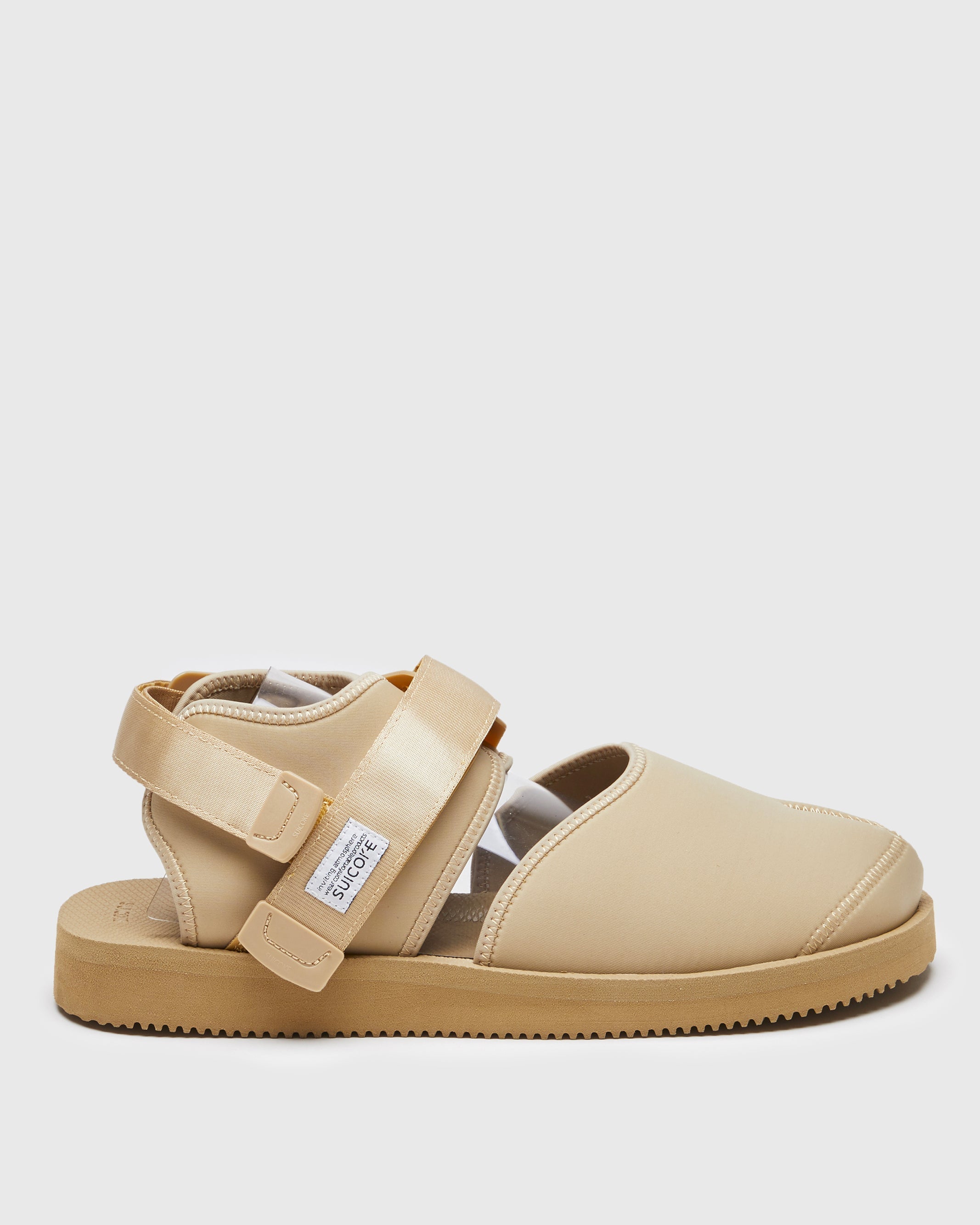 SUICOKE BITA-V shoes with beige nylon upper, beige midsole and sole, straps and logo patch. From Spring/Summer 2022 collection on SUICOKE Official US & Canada Webstore.