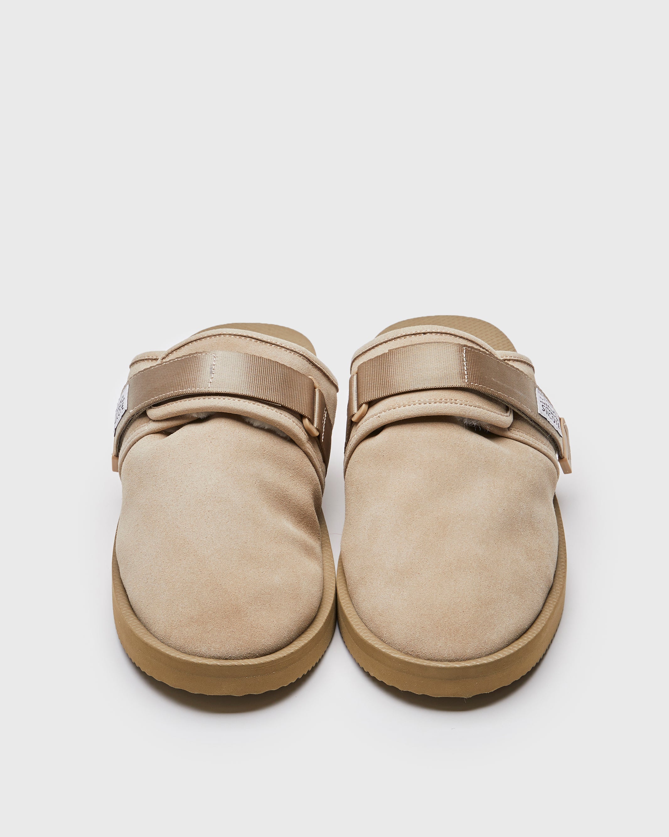 SUICOKE ZAVO-Mab closed toe slides with taupe suede upper, midsole and sole with shearling inside, nylon straps and tabs with logo patch and trim. From Fall/Winter 2021 collection on SUICOKE Official US & Canada Webstore.