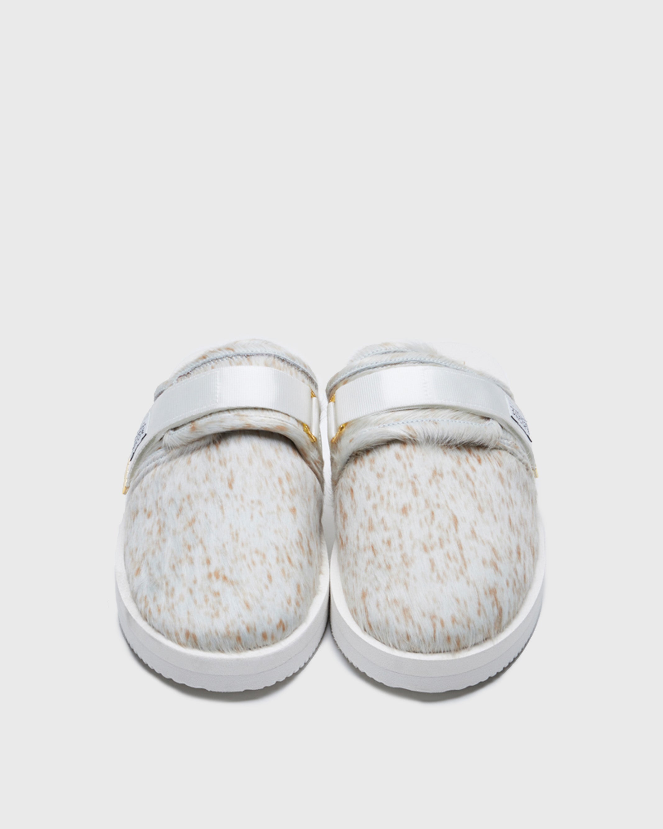 SUICOKE ZAVO-Vhl closed toe slides with white-brown speckled colored calf hair upper, white midsole and sole, nylon straps with logo patch and gold logoed tabs on SUICOKE Official US & Canada Webstore.