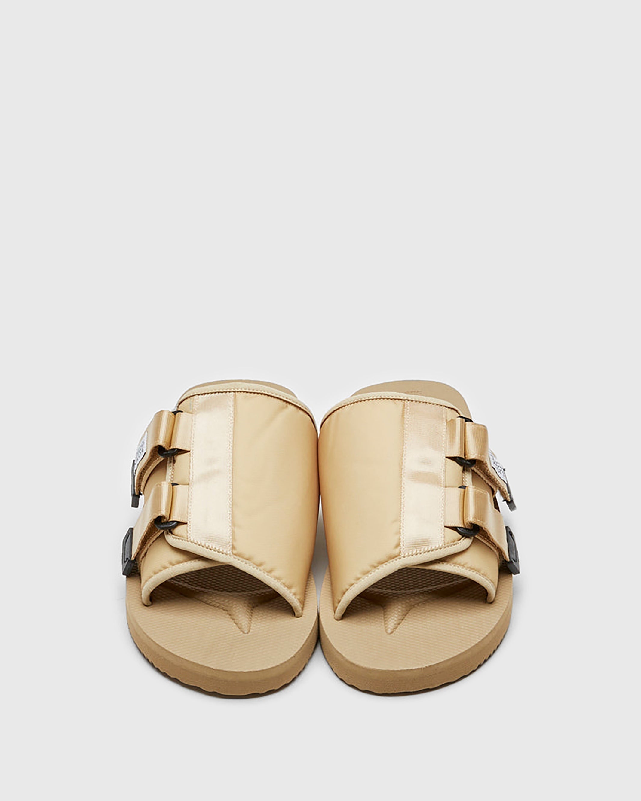 SUICOKE KAW-Cab slides with beige nylon upper, beige midsole and sole, strap and logo patch. From Spring/Summer 2023 collection on SUICOKE Official US & Canada Webstore OG-081CAB BEIGE