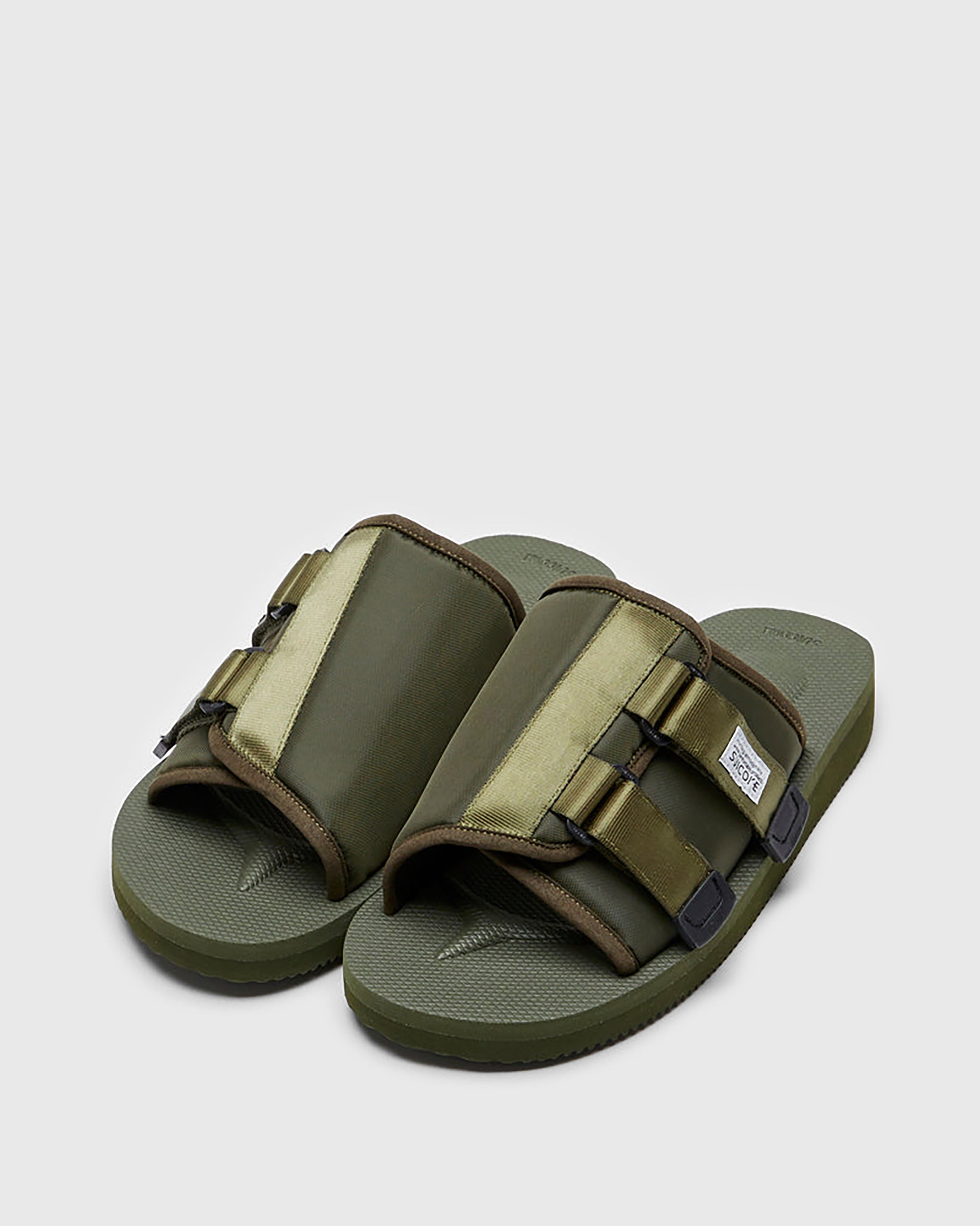 SUICOKE KAW-Cab sandals with olive nylon upper, olive midsole and sole, straps and logo patch. From Spring/Summer 2023 collection on SUICOKE Official US & Canada Webstore. OG-081CAB OLIVE