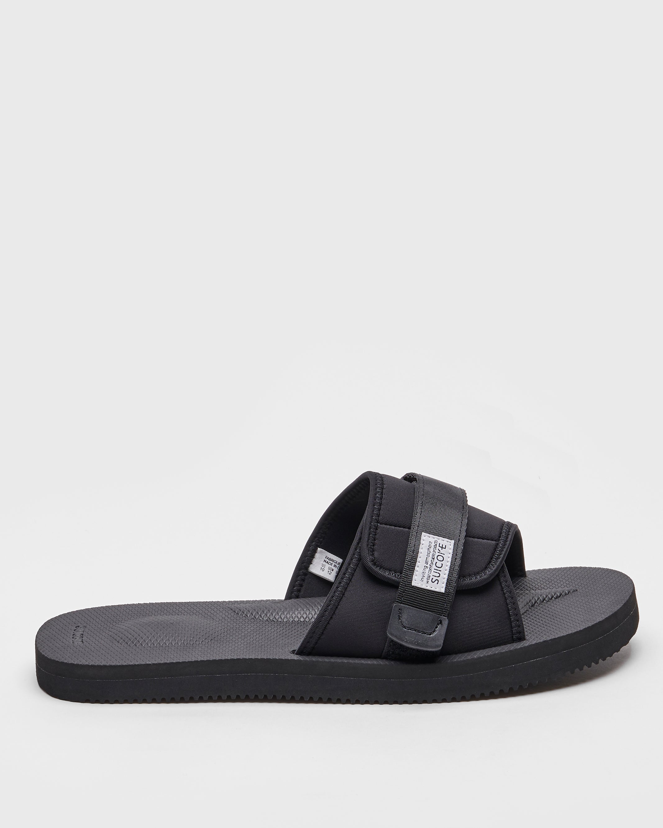 SUICOKE PADRI slides with black calf hair upper, black midsole and sole, strap and logo patch. From Spring/Summer 2022 collection on SUICOKE Official US & Canada Webstore.