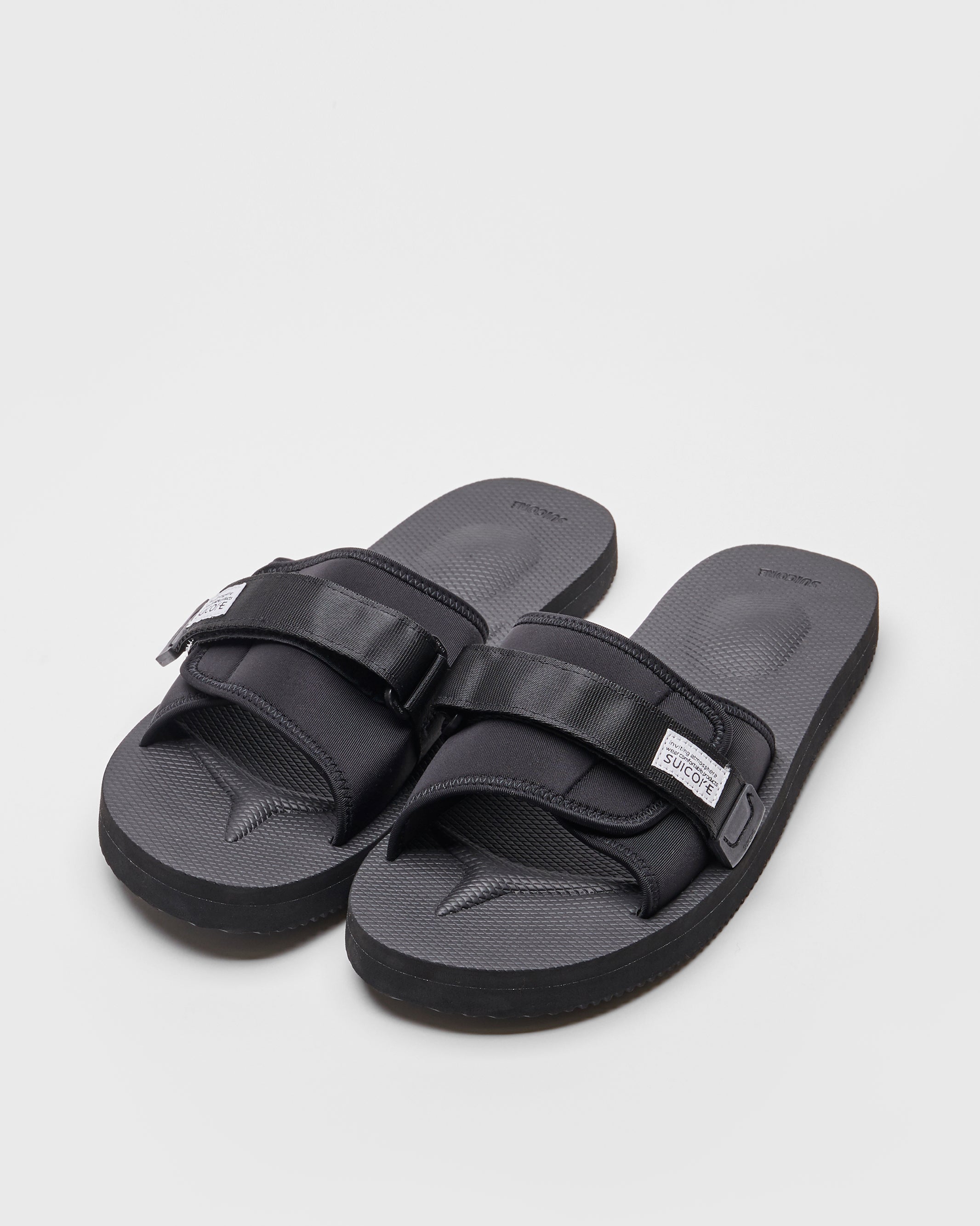 SUICOKE PADRI slides with black calf hair upper, black midsole and sole, strap and logo patch. From Spring/Summer 2022 collection on SUICOKE Official US & Canada Webstore.