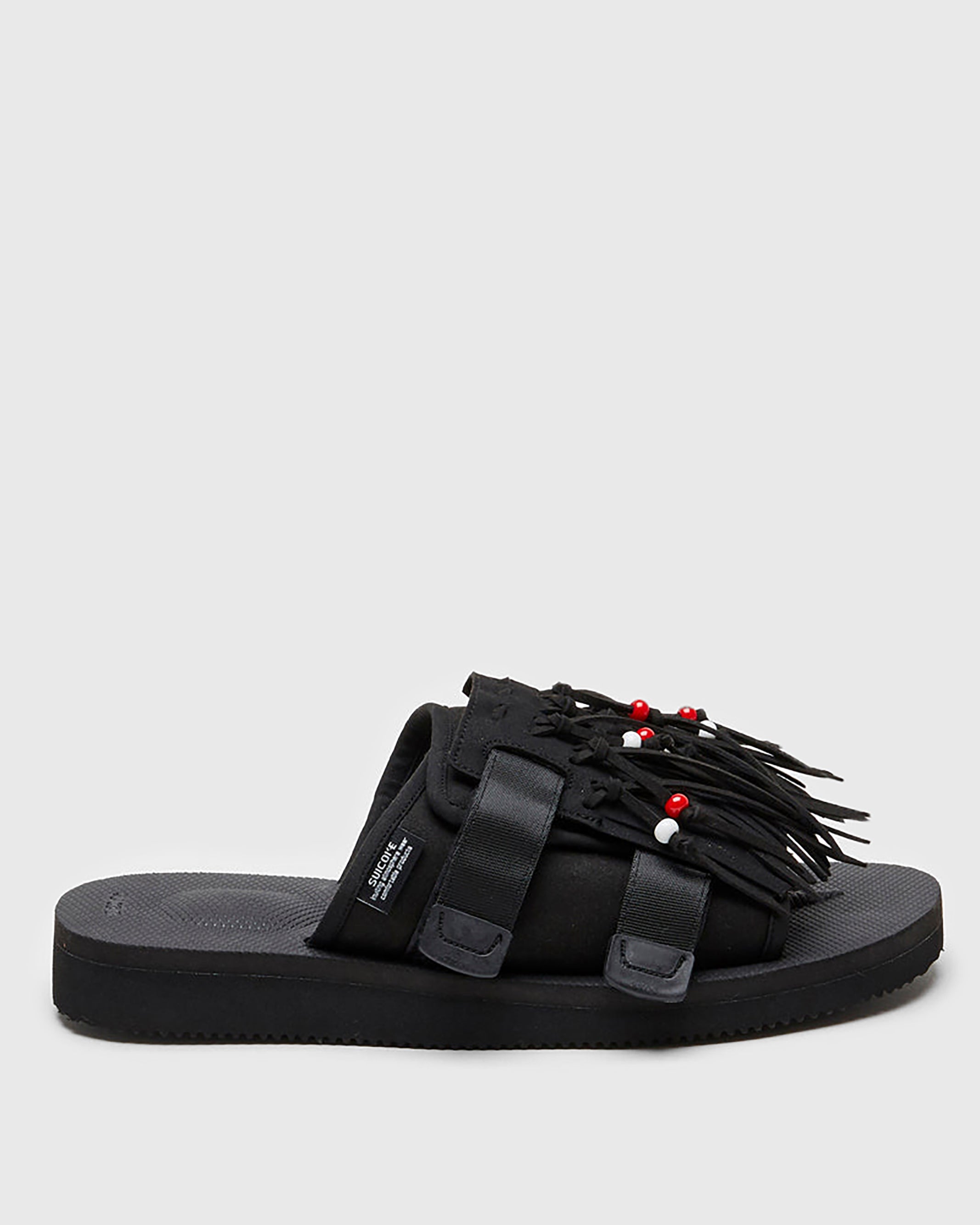 SUICOKE HOTO-Cab slides with black PU suede and nylon upper, black midsole and sole, straps and logo patch. From Spring/Summer 2022 collection on SUICOKE Official US & Canada Webstore.