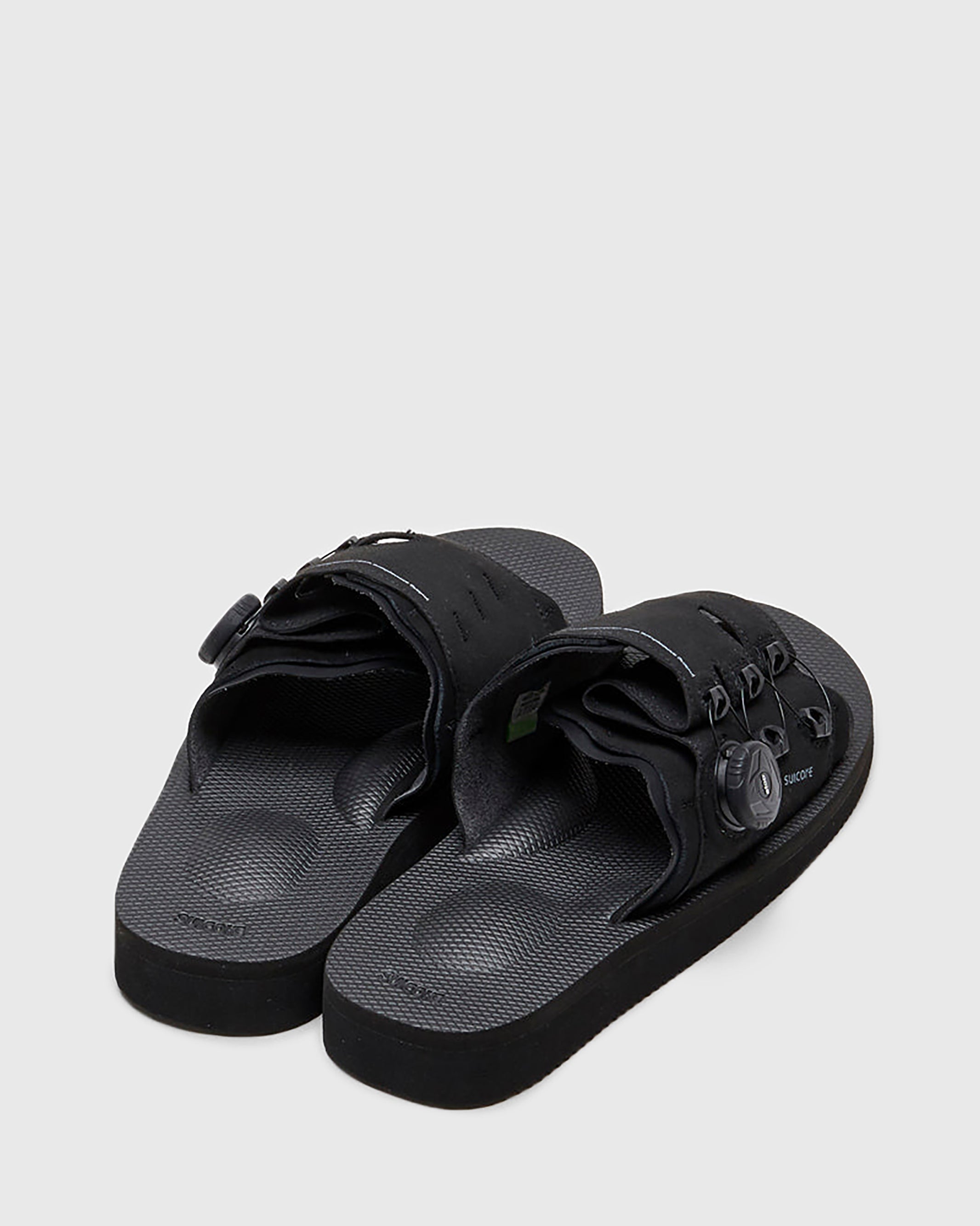 SUICOKE LETA-ab slides with black PU suede upper, black midsole and sole, laces and logo patch. From Spring/Summer 2022 collection on SUICOKE Official US & Canada Webstore.