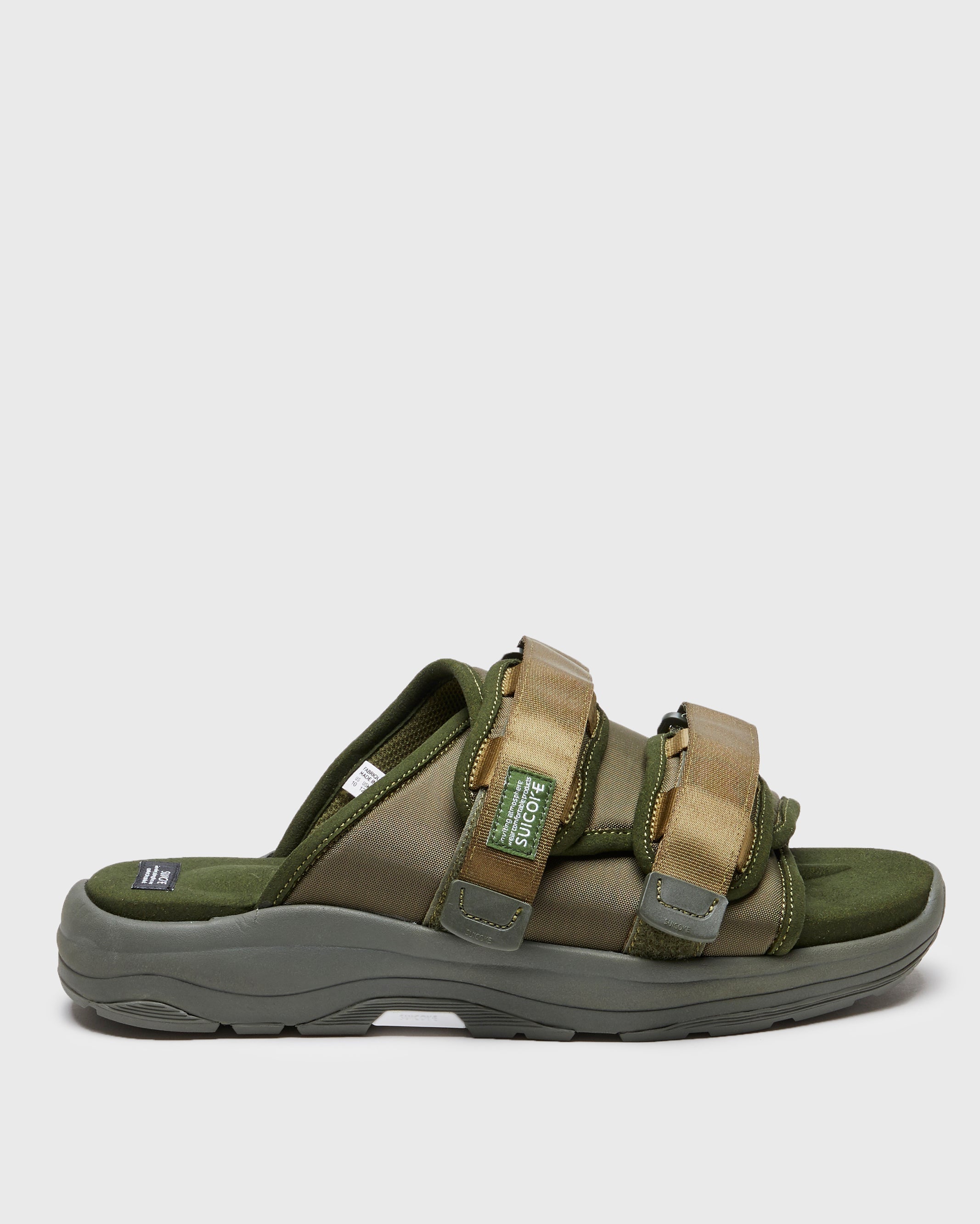 SUICOKE MOTO-Run slides with olive nylon upper, olive midsole and sole, strap and logo patch. From Spring/Summer 2023 collection on SUICOKE Official US & Canada Webstore. OG-332 OLIVE.