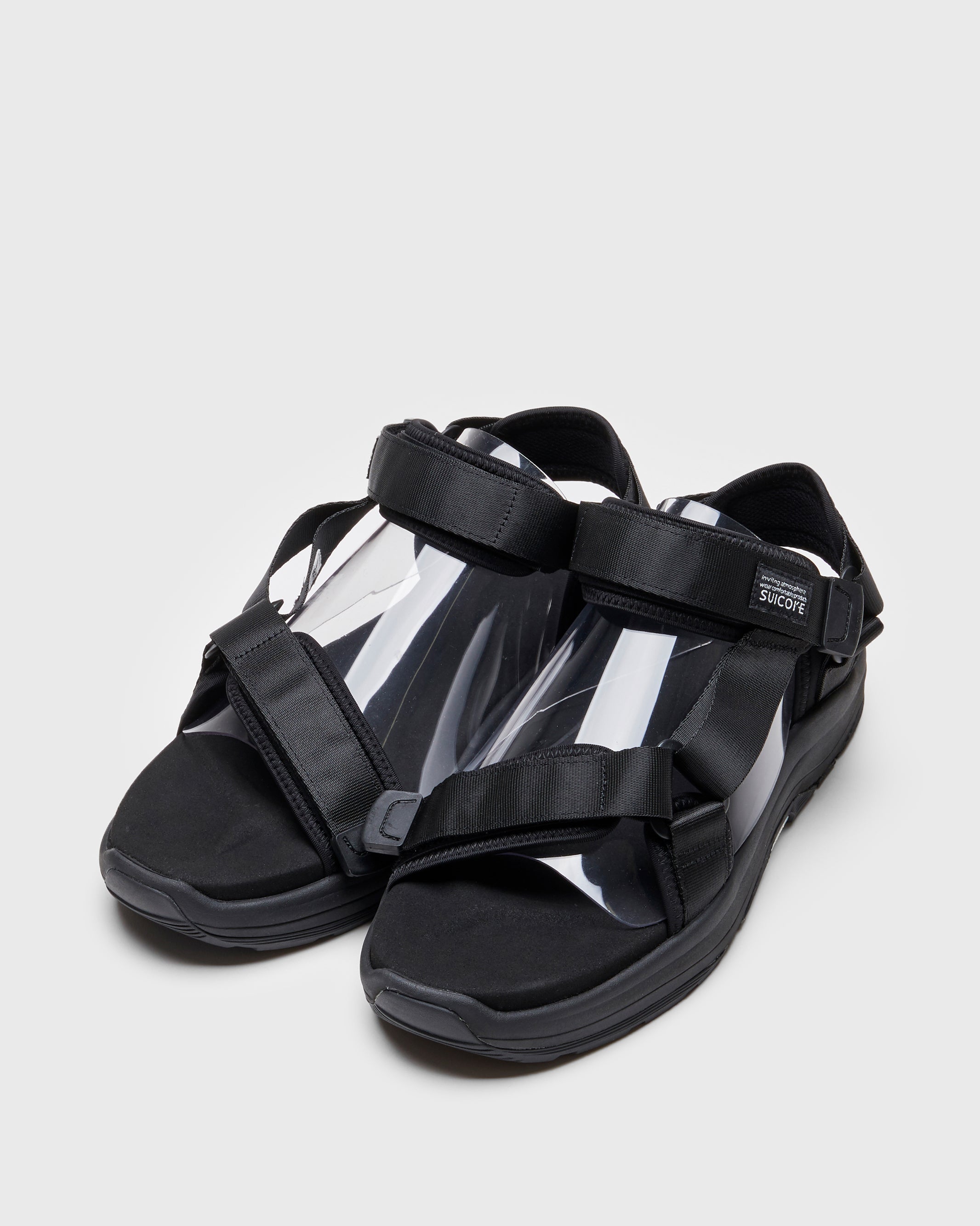 SUICOKE DEPA-Run slides with black nylon upper, black midsole and sole, strap and logo patch. From Spring/Summer 2023 collection on SUICOKE Official US & Canada Webstore. OG-333 BLACK.