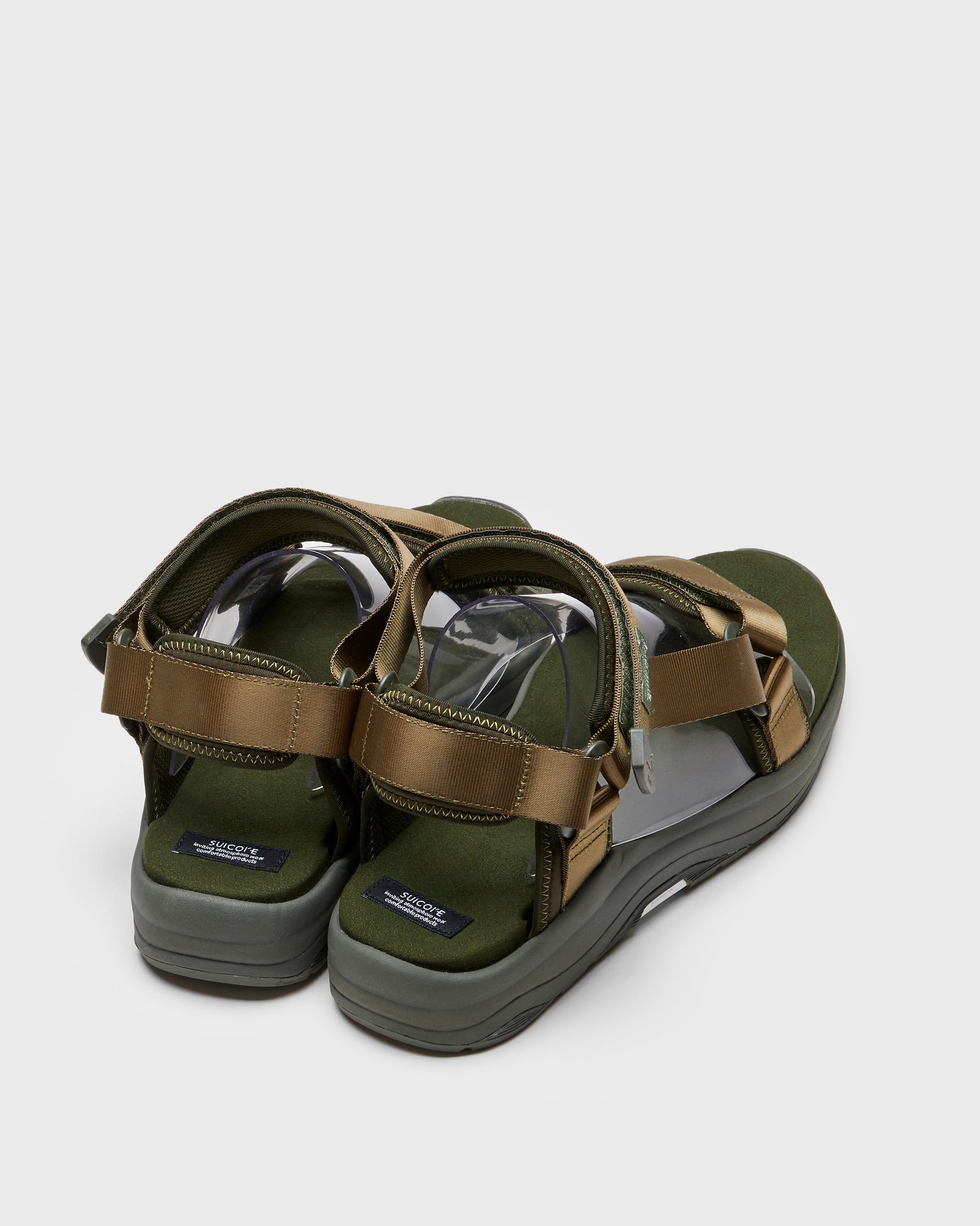 SUICOKE DEPA-Run slides with olive nylon upper, olive midsole and sole, strap and logo patch. From Spring/Summer 2023 collection on SUICOKE Official US & Canada Webstore. OG-333 OLIVE.