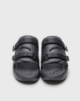 SUICOKE URICH slides with black rubber upper, black midsole and sole, straps and logo patch. From Spring/Summer 2022 collection on SUICOKE Official US & Canada Webstore. OG-INJ-01 BLACK