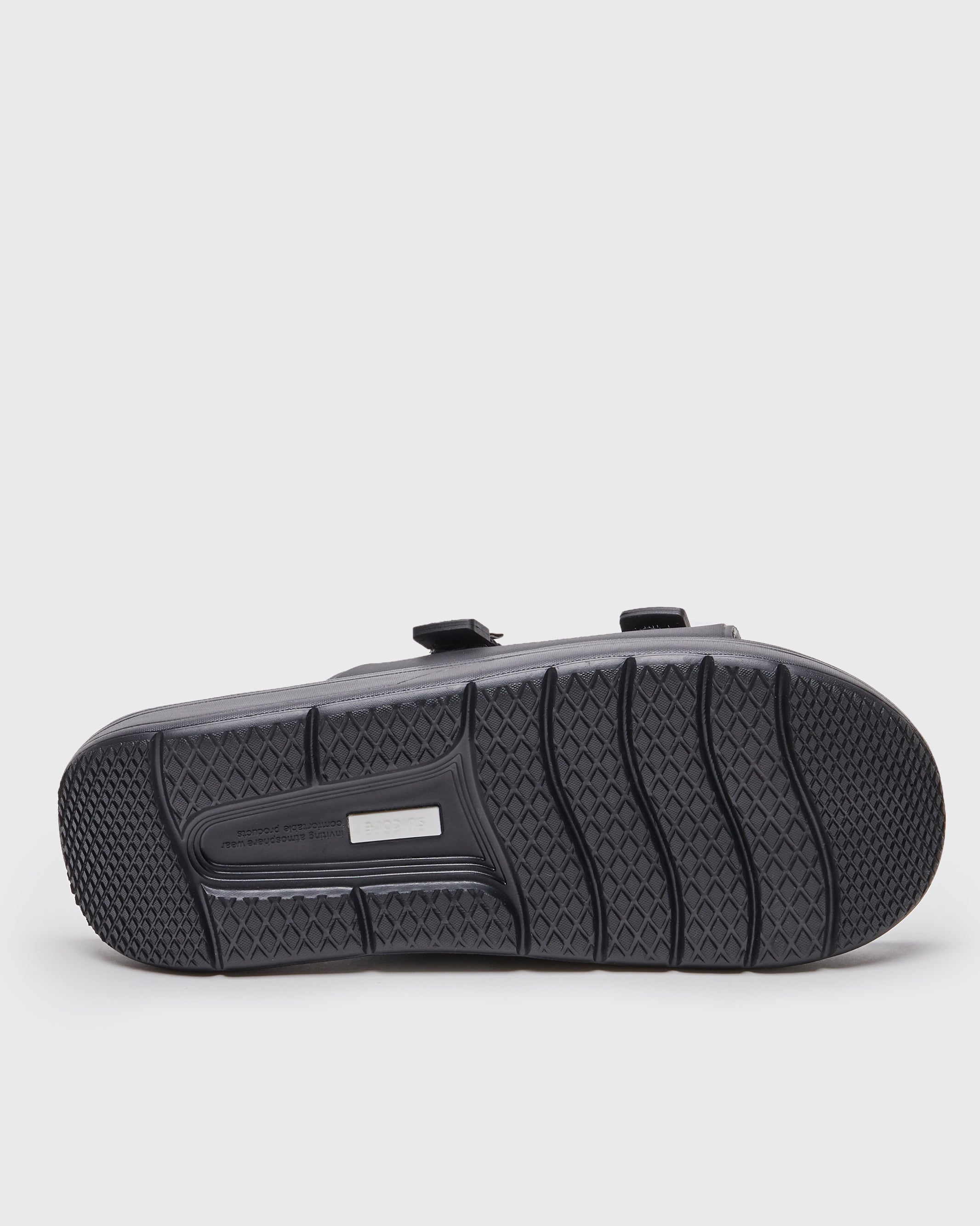 SUICOKE URICH slides with black rubber upper, black midsole and sole, straps and logo patch. From Spring/Summer 2022 collection on SUICOKE Official US & Canada Webstore. OG-INJ-01 BLACK