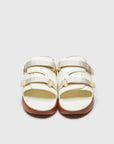 SUICOKE URICH slides with off-white rubber upper, off-white rubber midsole and sole, off white nylon strap and logo patch. From Spring/Summer 2023 collection on SUICOKE Official US & Canada Webstore. OG-INJ-01 OFF WHITE