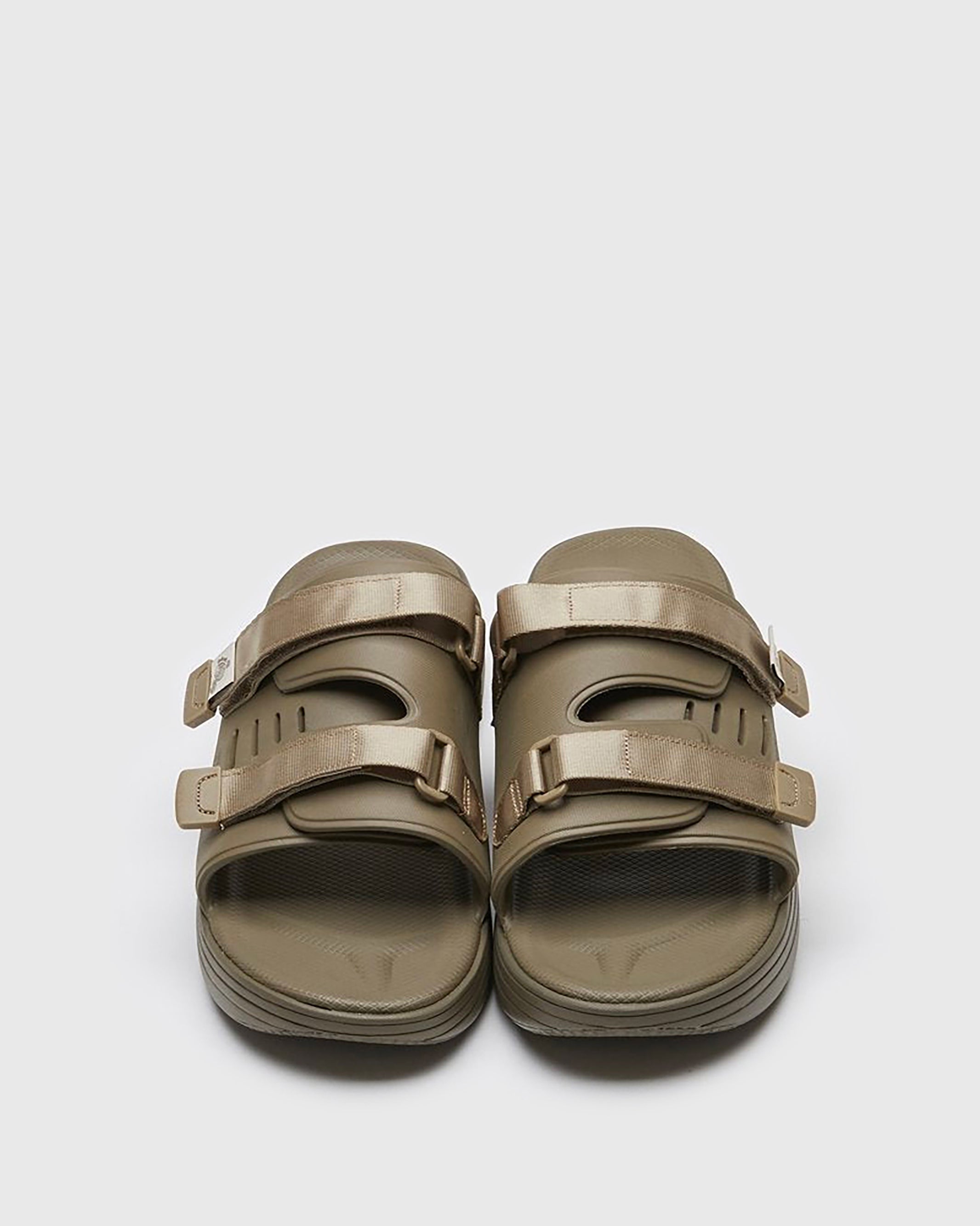 SUICOKE URICH slides with olive rubber upper, olive midsole and sole, straps and logo patch. From Spring/Summer 2022 collection on SUICOKE Official US & Canada Webstore. OG-INJ-01 OLIVE