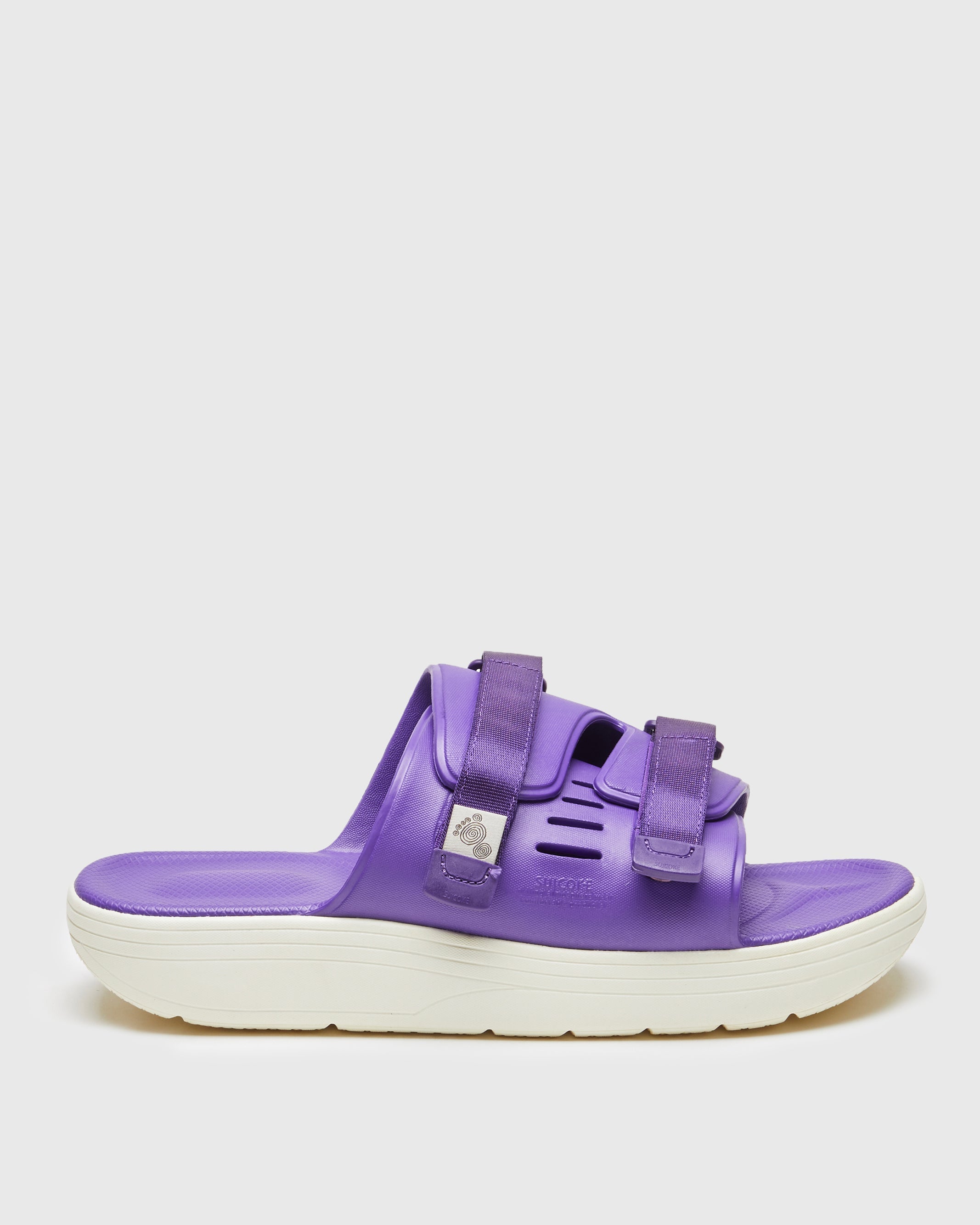 SUICOKE URICH slides with purple rubber upper, purple rubber midsole and sole, purple nylon strap and logo patch. From Spring/Summer 2023 collection on SUICOKE Official US & Canada Webstore. OG-INJ-01 PURPLE.