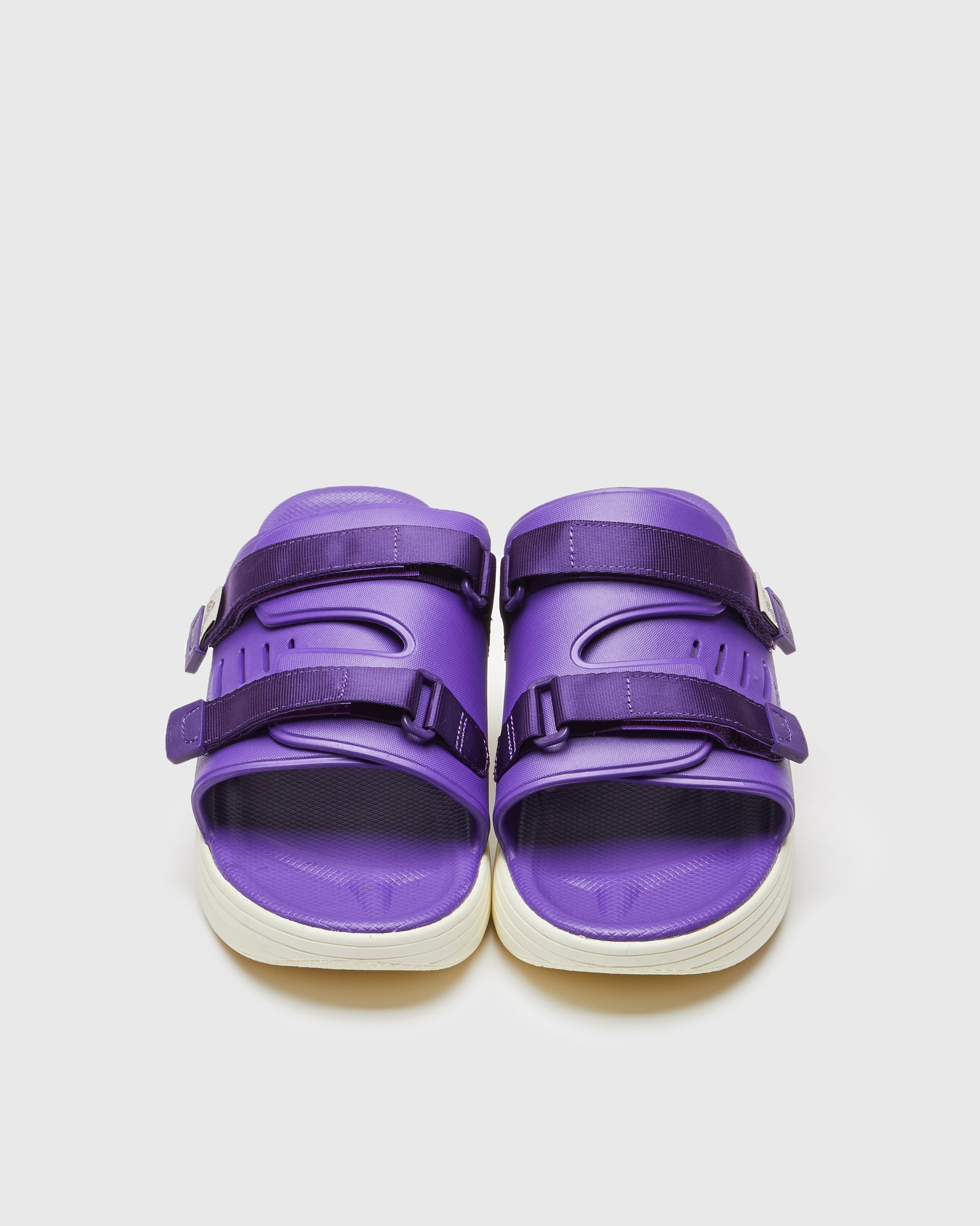 SUICOKE URICH slides with purple rubber upper, purple rubber midsole and sole, purple nylon strap and logo patch. From Spring/Summer 2023 collection on SUICOKE Official US & Canada Webstore. OG-INJ-01 PURPLE.