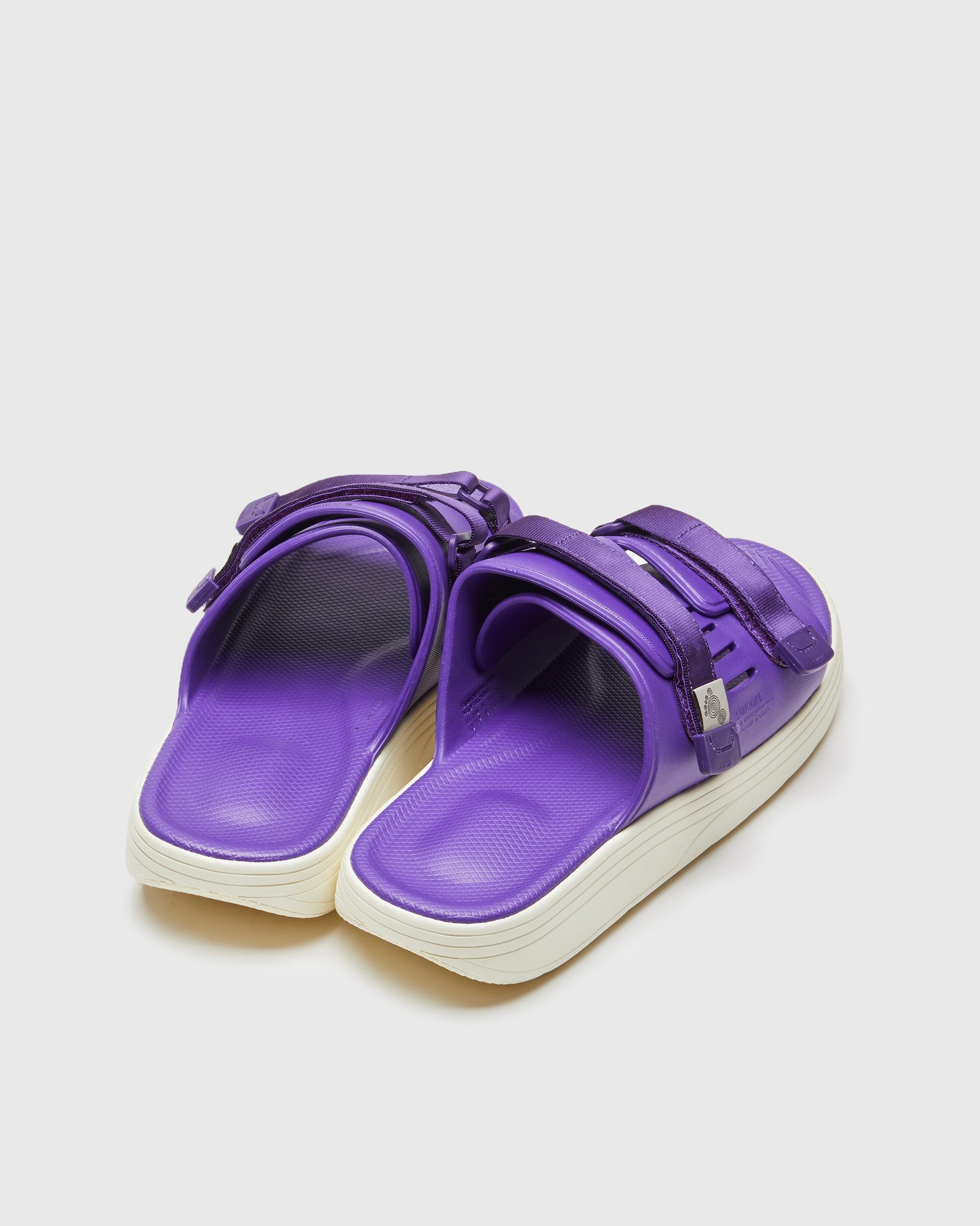 SUICOKE URICH slides with purple rubber upper, purple rubber midsole and sole, purple nylon strap and logo patch. From Spring/Summer 2023 collection on SUICOKE Official US & Canada Webstore. OG-INJ-01 PURPLE.