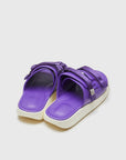 SUICOKE URICH slides with purple rubber upper, purple rubber midsole and sole, purple nylon strap and logo patch. From Spring/Summer 2023 collection on SUICOKE Official US & Canada Webstore. OG-INJ-01 PURPLE.