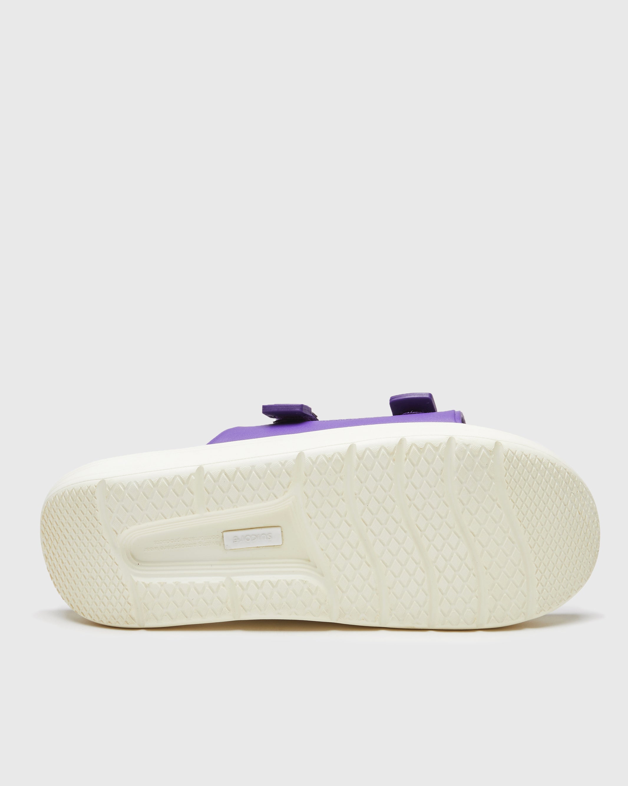 SUICOKE URICH slides with purple rubber upper, purple rubber midsole and sole, off white nylon strap and logo patch. From Spring/Summer 2023 collection on SUICOKE Official US & Canada Webstore. OG-INJ-01 PURPLE.