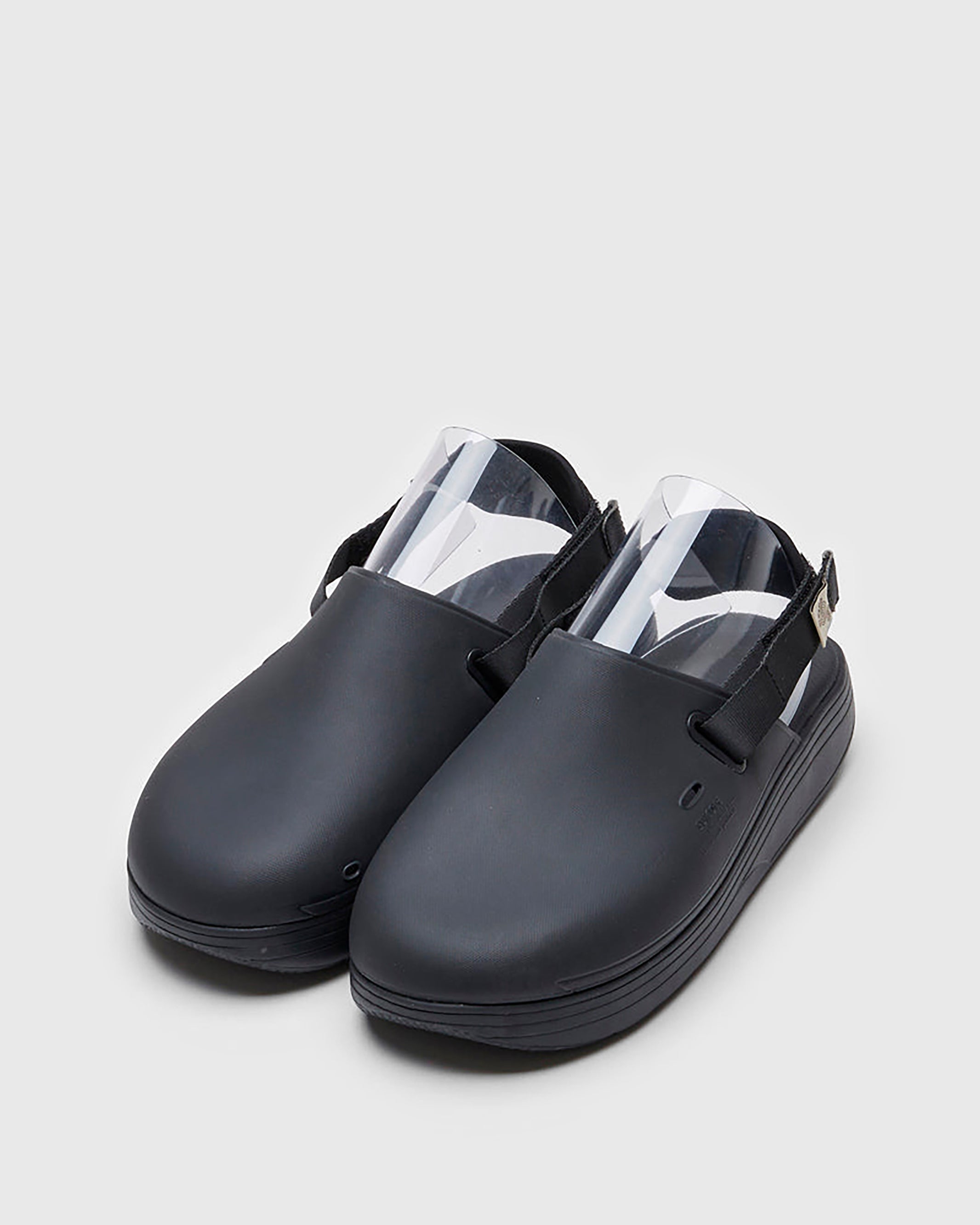 SUICOKE CAPPO sandals with black rubber upper, black midsole and sole, straps and logo patch. From Spring/Summer 2022 collection on SUICOKE Official US & Canada Webstore. OG-INJ-03 BLACK