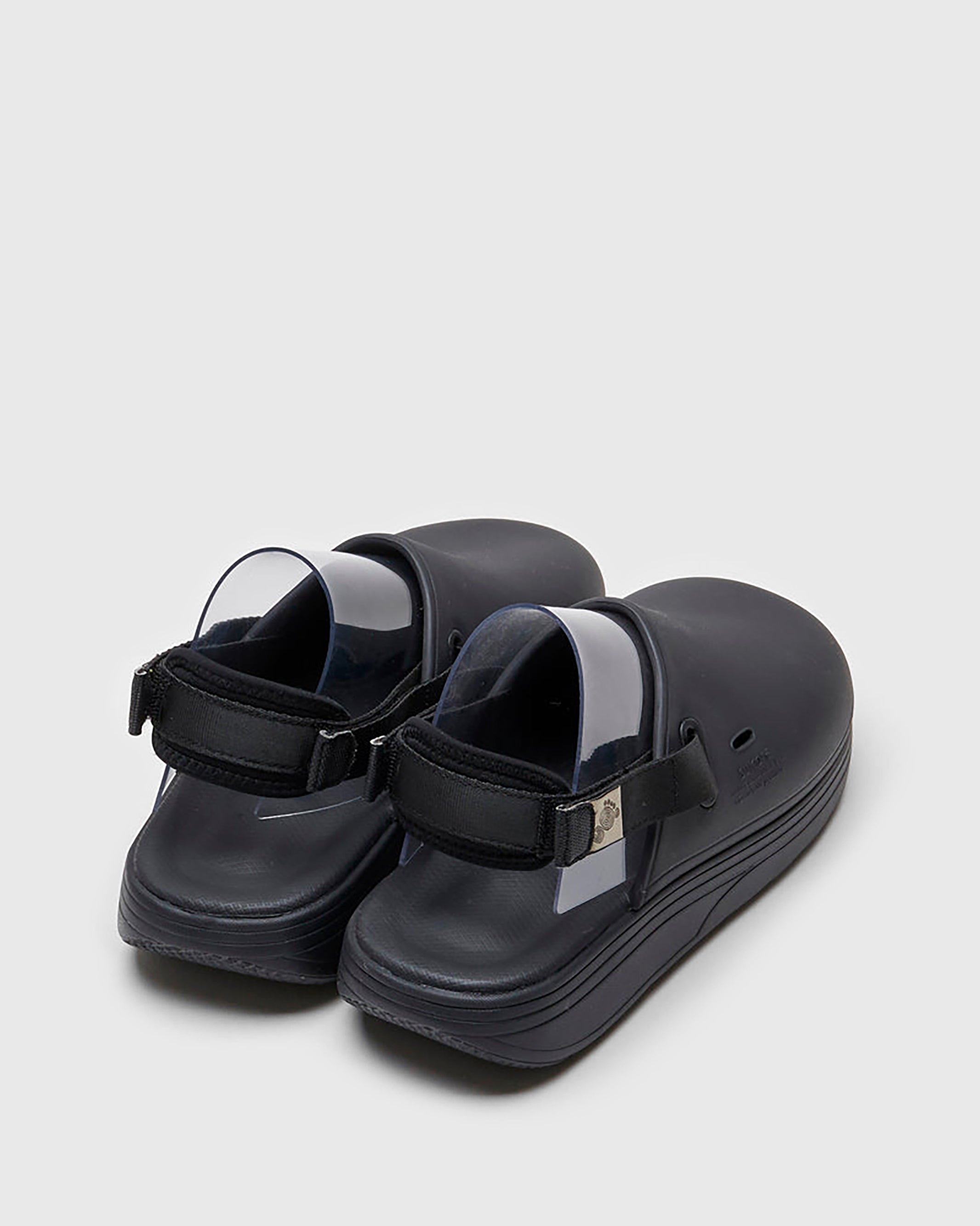 SUICOKE CAPPO sandals with black rubber upper, black midsole and sole, straps and logo patch. From Spring/Summer 2022 collection on SUICOKE Official US & Canada Webstore. OG-INJ-03 BLACK