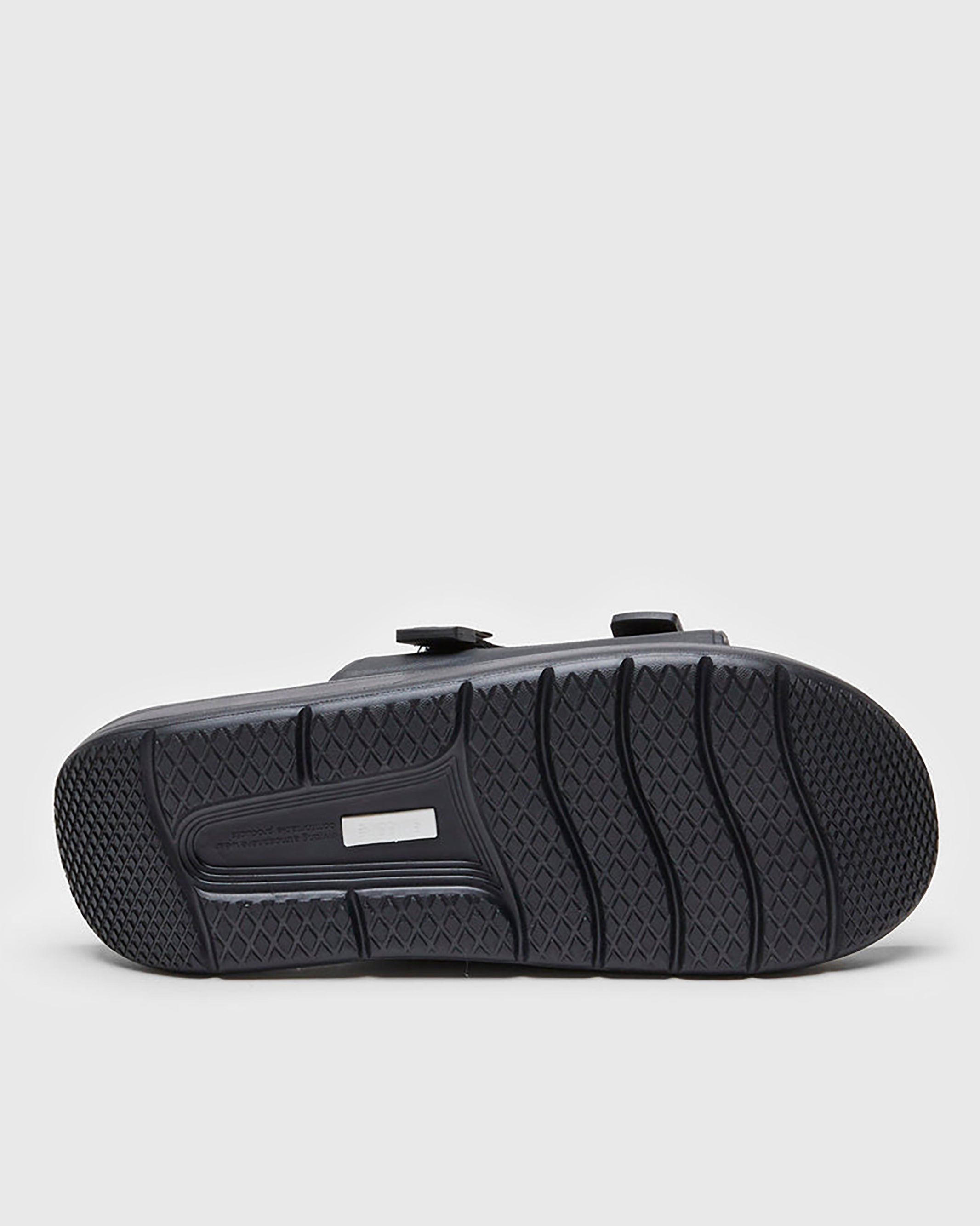 SUICOKE CAPPO sandals with black rubber upper, black midsole and sole, straps and logo patch. From Spring/Summer 2022 collection on SUICOKE Official US & Canada Webstore. OG-INJ-03 BLACK