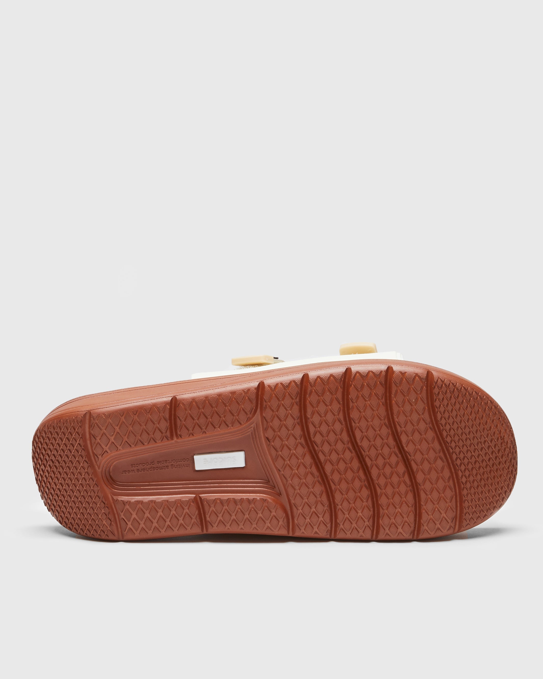 SUICOKE CAPPO slides with off-white rubber upper, off-white rubber midsole and sole, off white nylon strap and logo patch. From Spring/Summer 2023 collection on SUICOKE Official US & Canada Webstore. OG-INJ-03 OFF WHITE