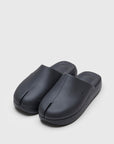 SUICOKE POLK slides with black rubber upper, black midsole and sole, straps and logo patch. From Spring/Summer 2022 collection on SUICOKE Official US & Canada Webstore. OG-INJ-04 BLACK