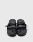 SUICOKE UTA slides with black rubber upper, black midsole and sole, straps and logo patch. From Spring/Summer 2022 collection on SUICOKE Official US & Canada Webstore.