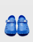 SUICOKE MOK slides with blue rubber upper, blue midsole and sole, straps and logo patch. From Spring/Summer 2023 collection on SUICOKE Official US & Canada Webstore. OG-INJ101 BLUE