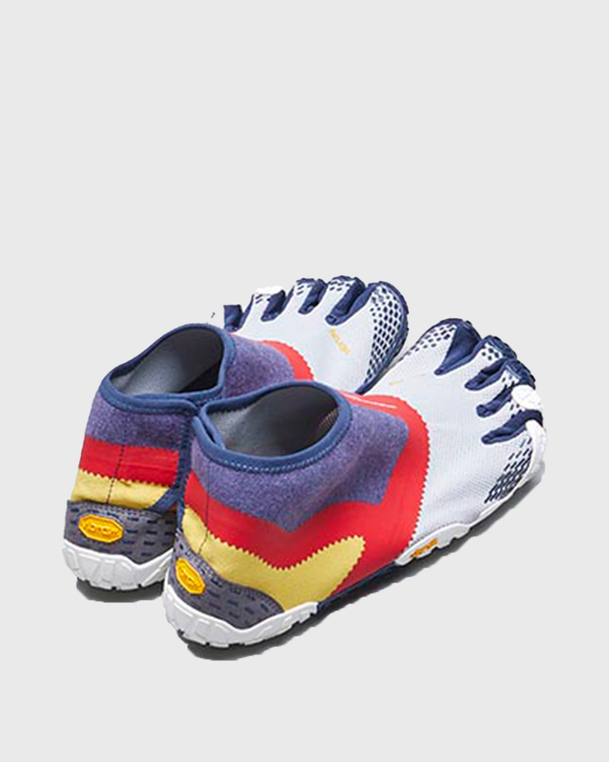 SUICOKE NIN-LO sneakers with navy & red nylon upper, navy & red midsole and sole, and logo patch. From Spring/Summer 2023 collection on SUICOKE Official US & Canada Webstore. S20MLC2 NAVY X RED